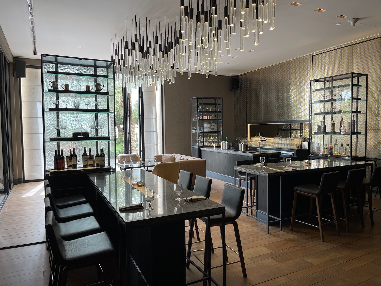 a room with a bar and a table and chairs