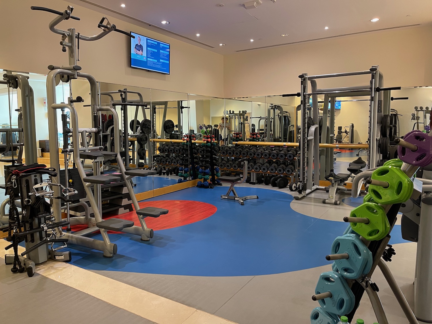 a gym with many exercise equipment