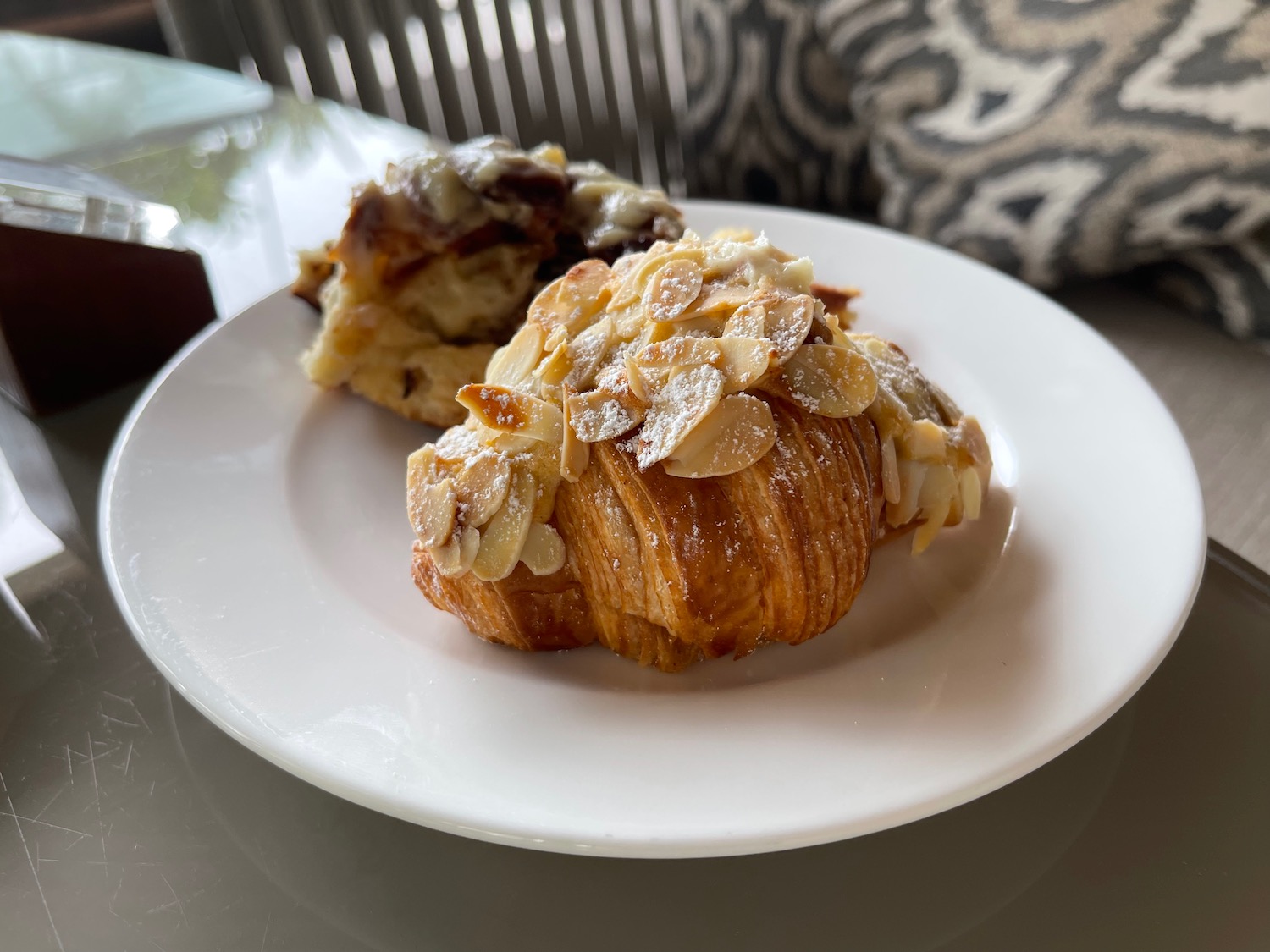 a plate of pastries with almonds on top