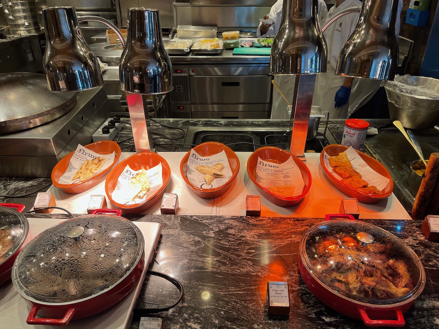 a kitchen with many plates of food