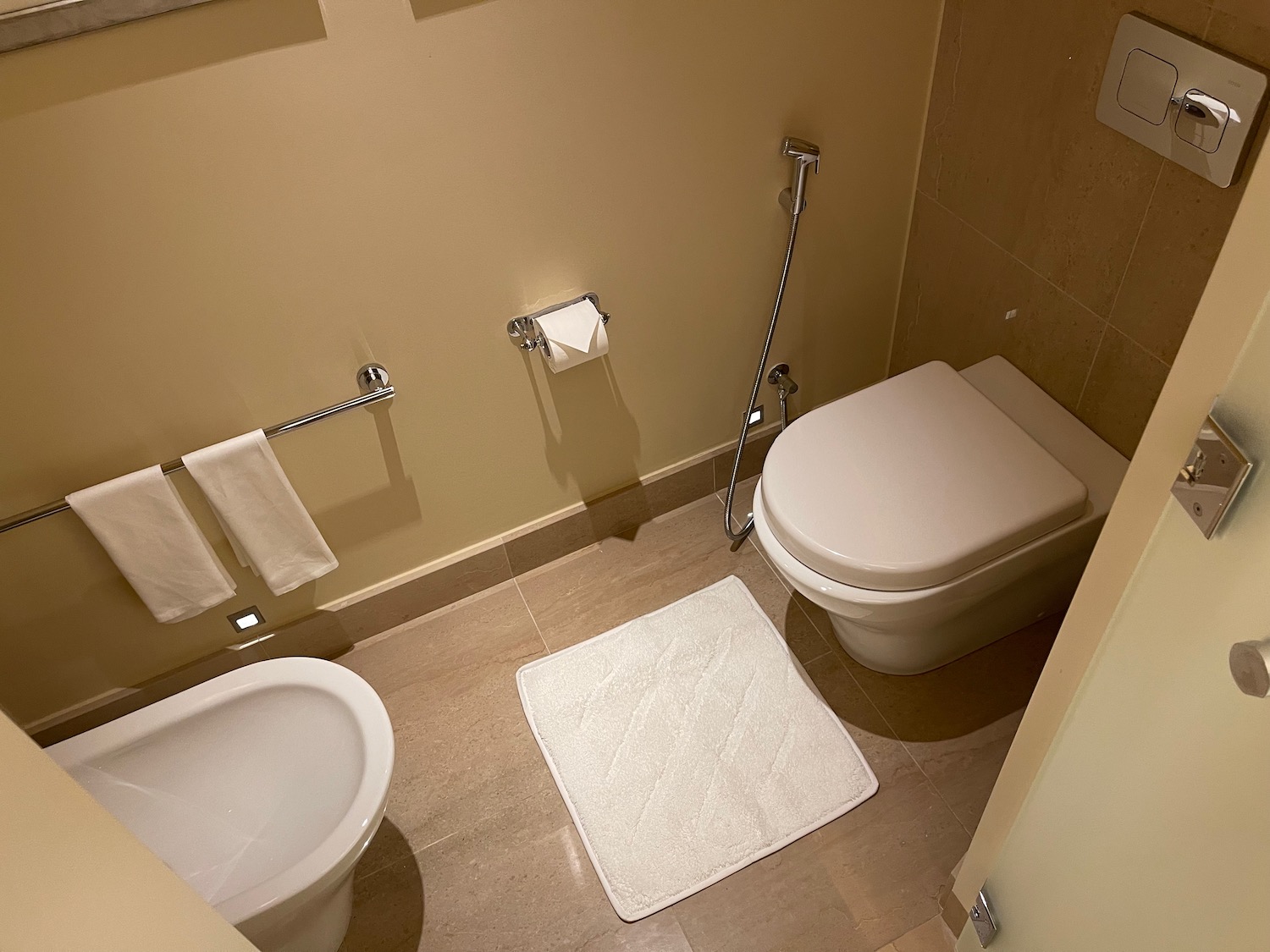 a toilet and bidet in a bathroom