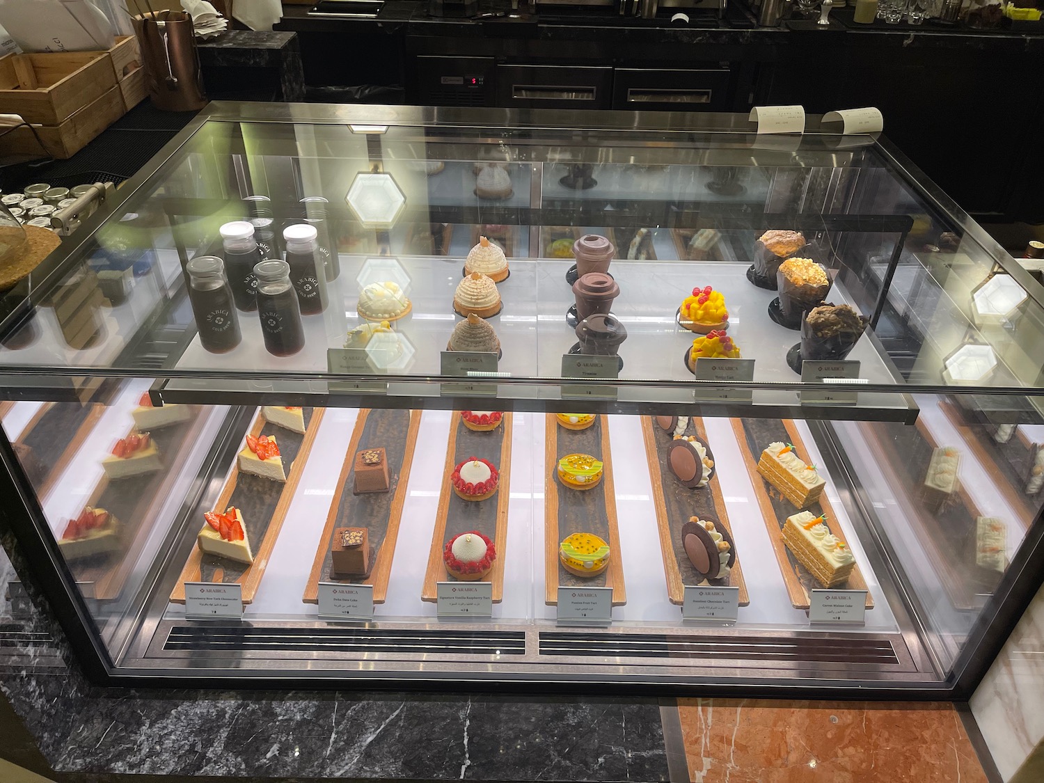 a display case with different kinds of desserts