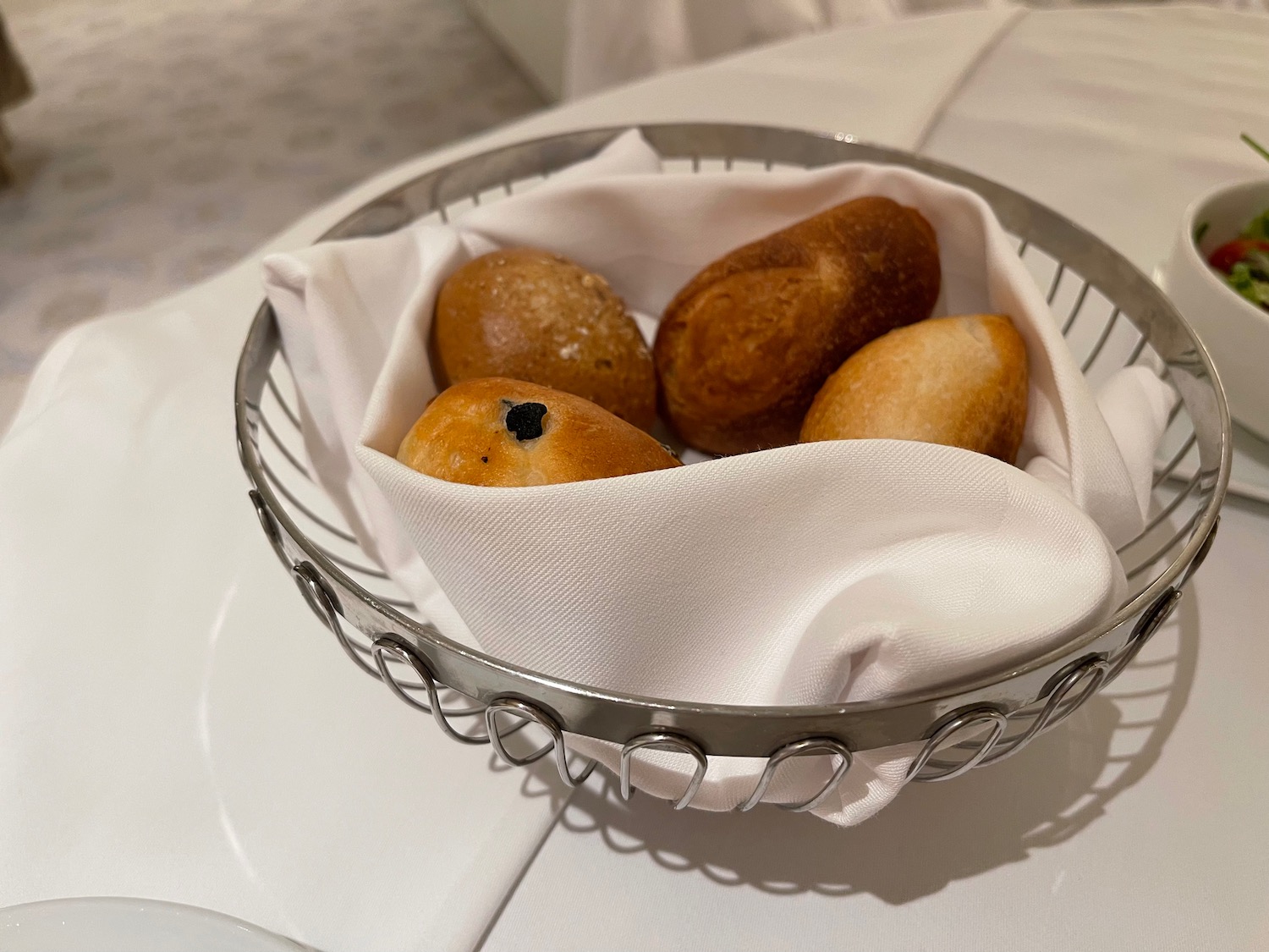 a basket of bread and a napkin