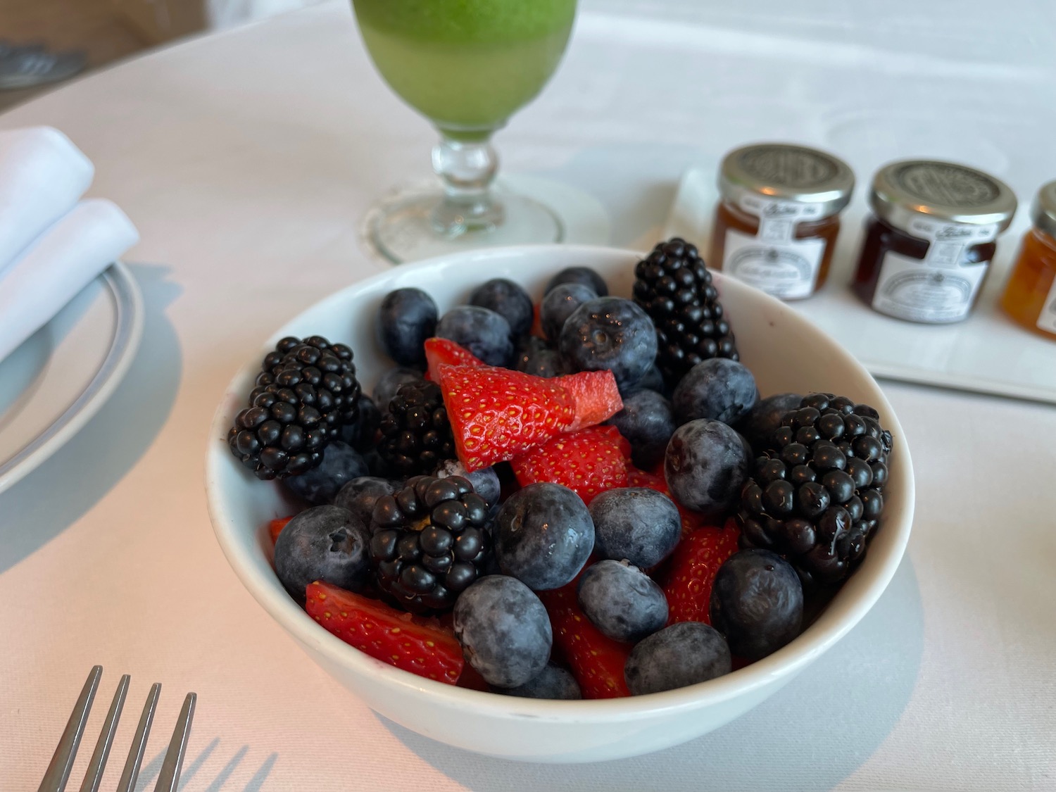 a bowl of fruit on a table