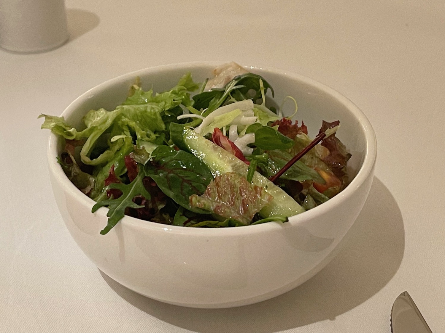 a bowl of salad on a table