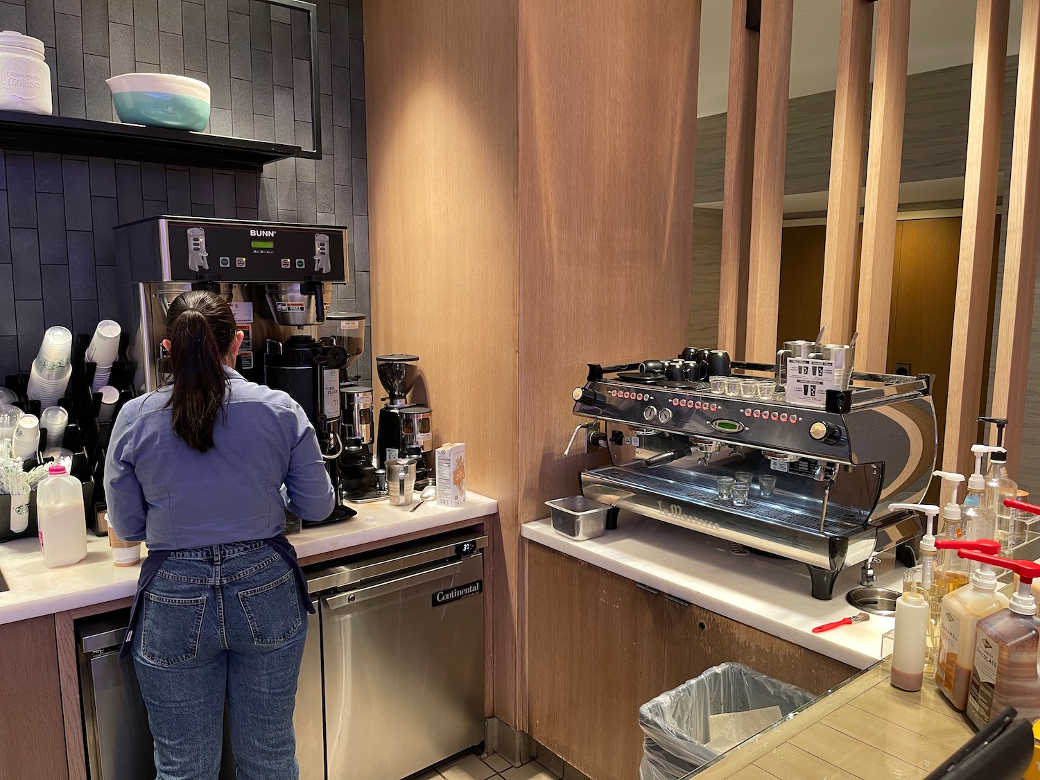 a woman standing in a kitchen