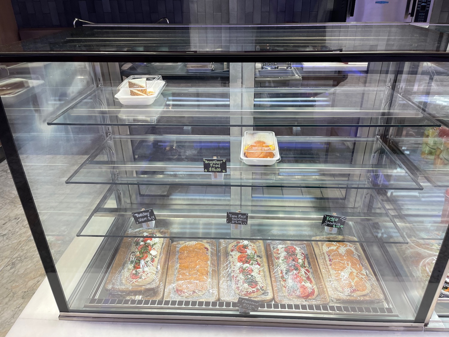 a glass case with food in it