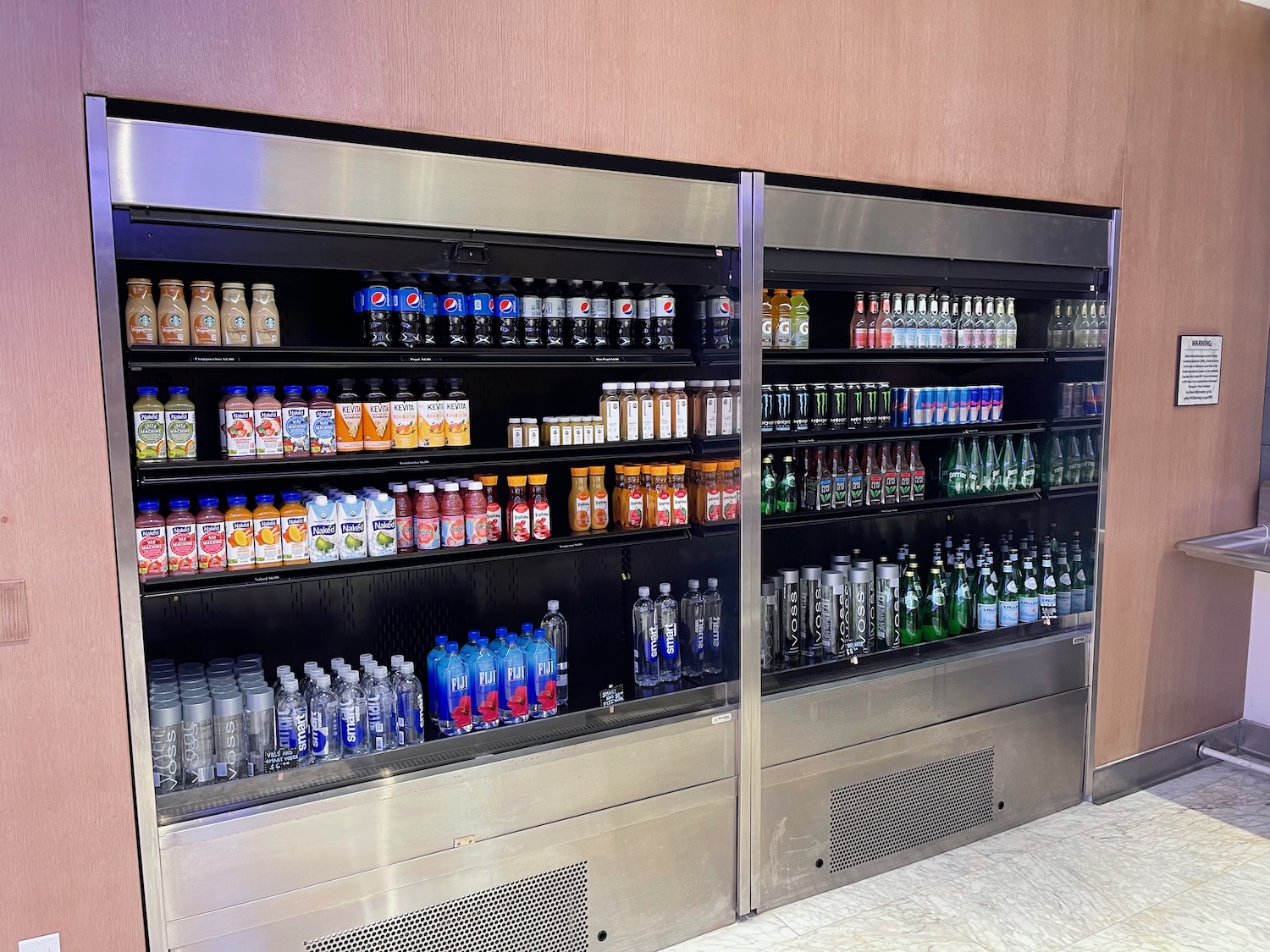 a display case with drinks on it