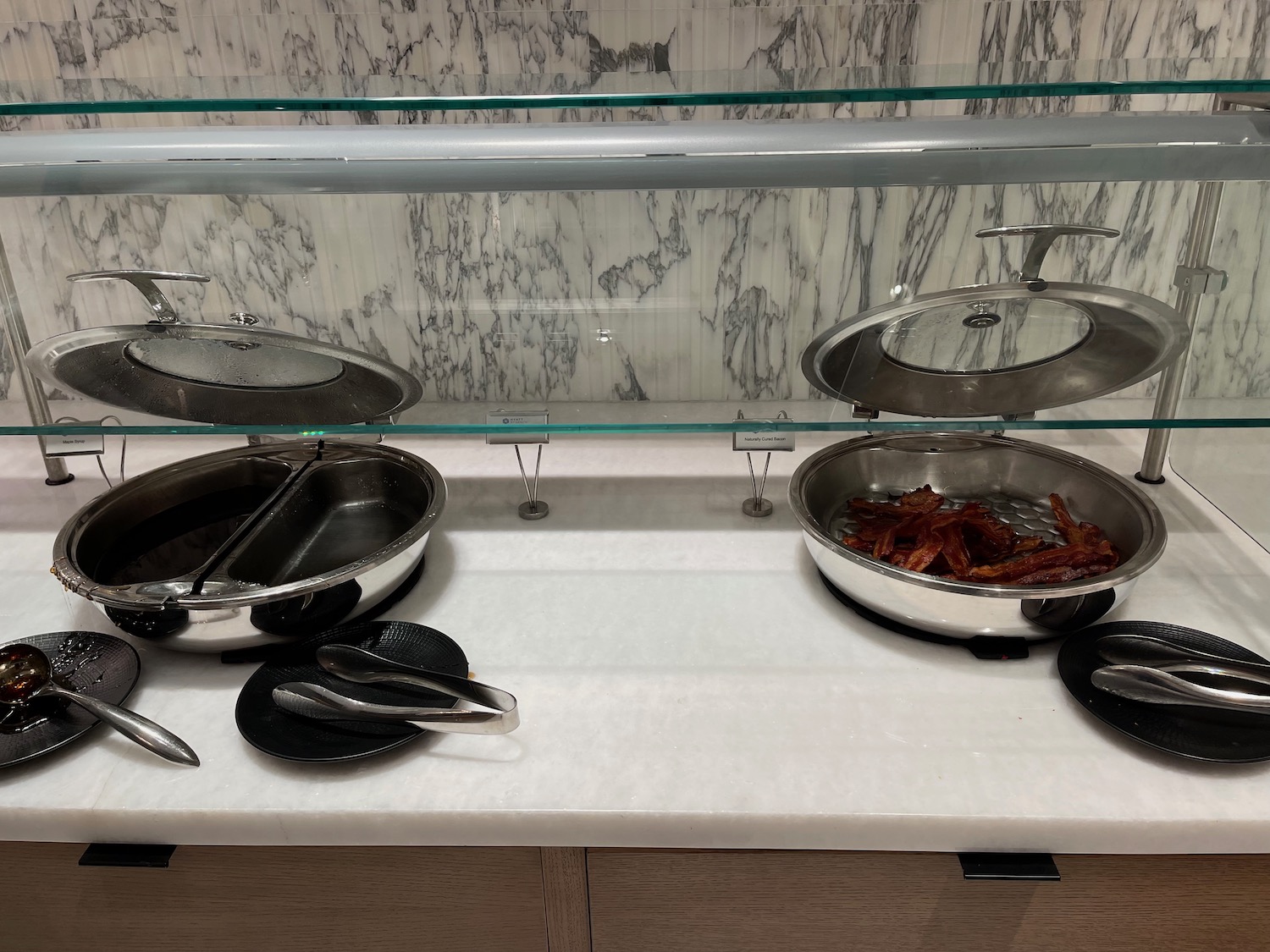 a buffet line with pans and food
