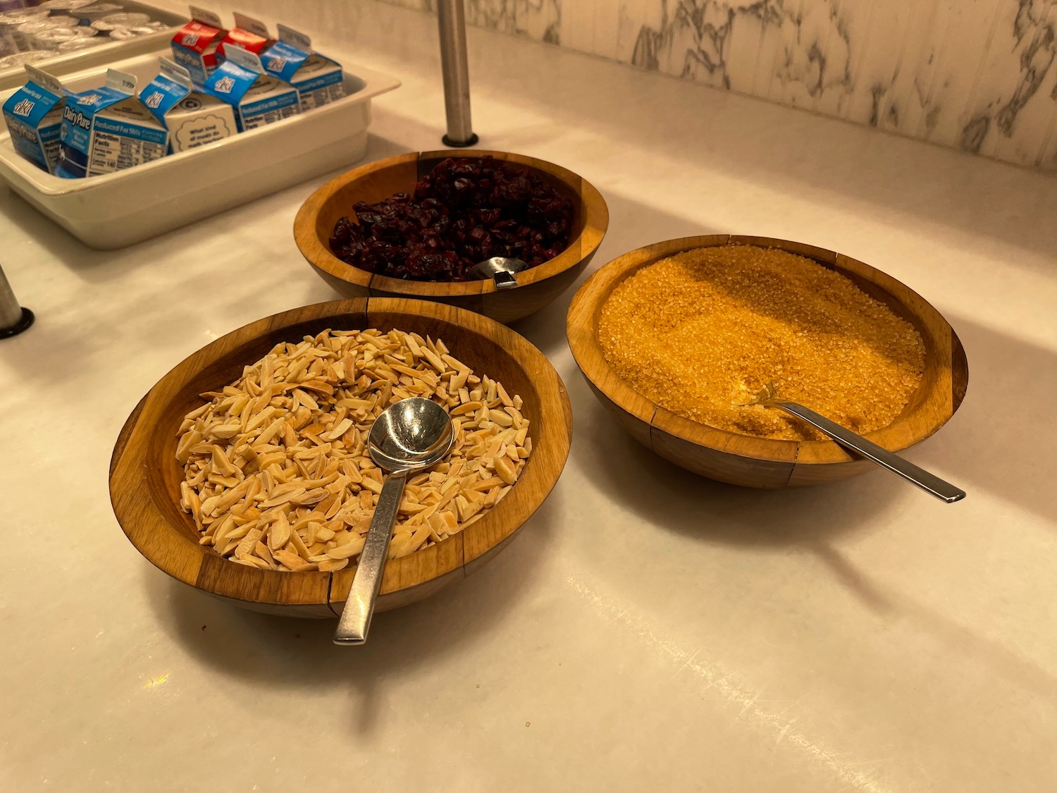 a group of bowls of cereals and a spoon