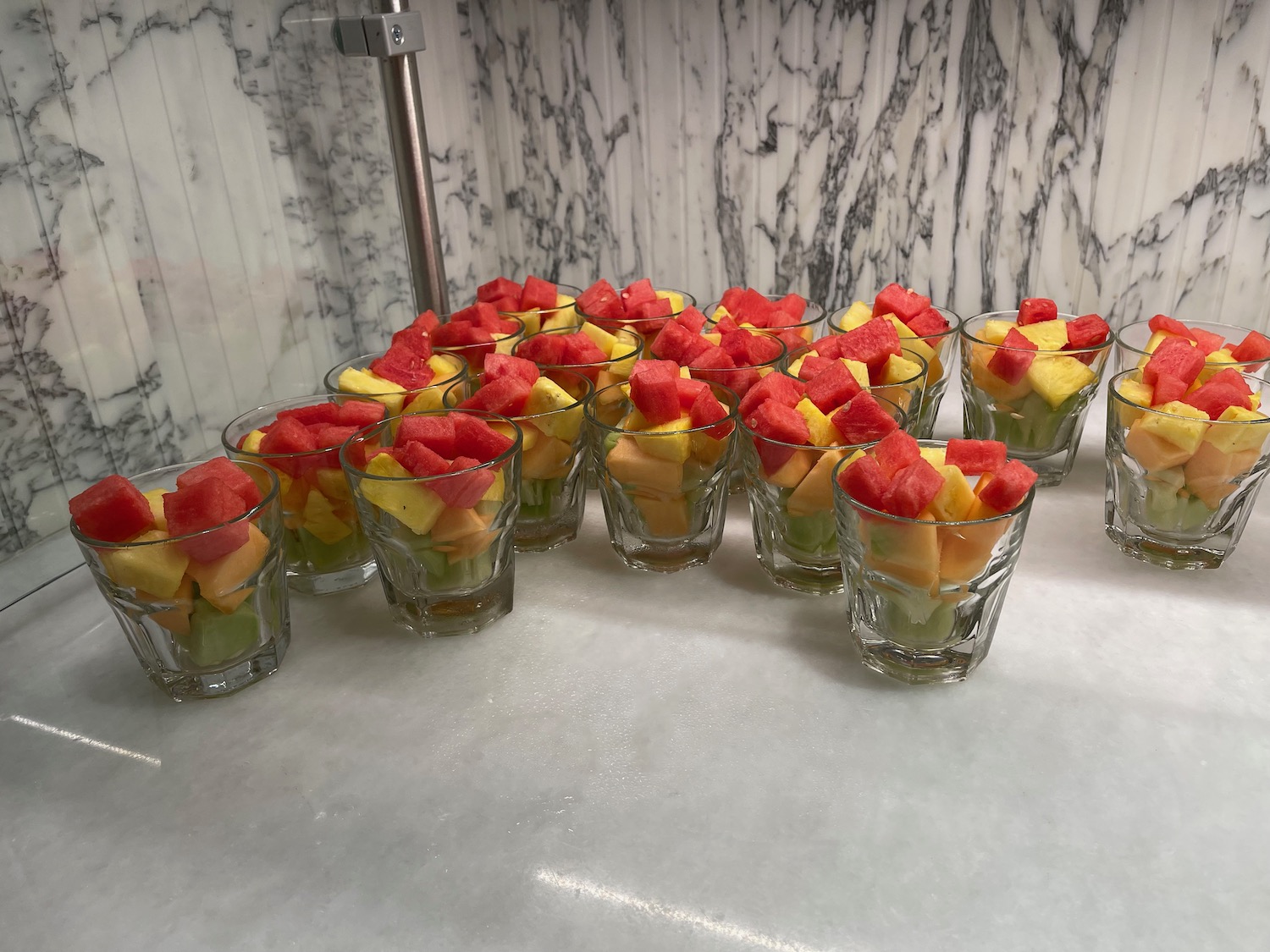 a group of glasses filled with fruit