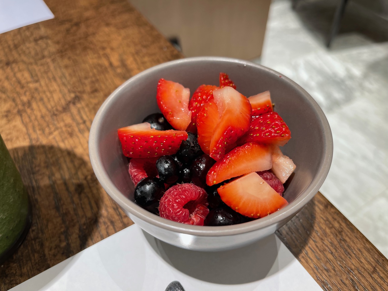 a bowl of fruit on a table