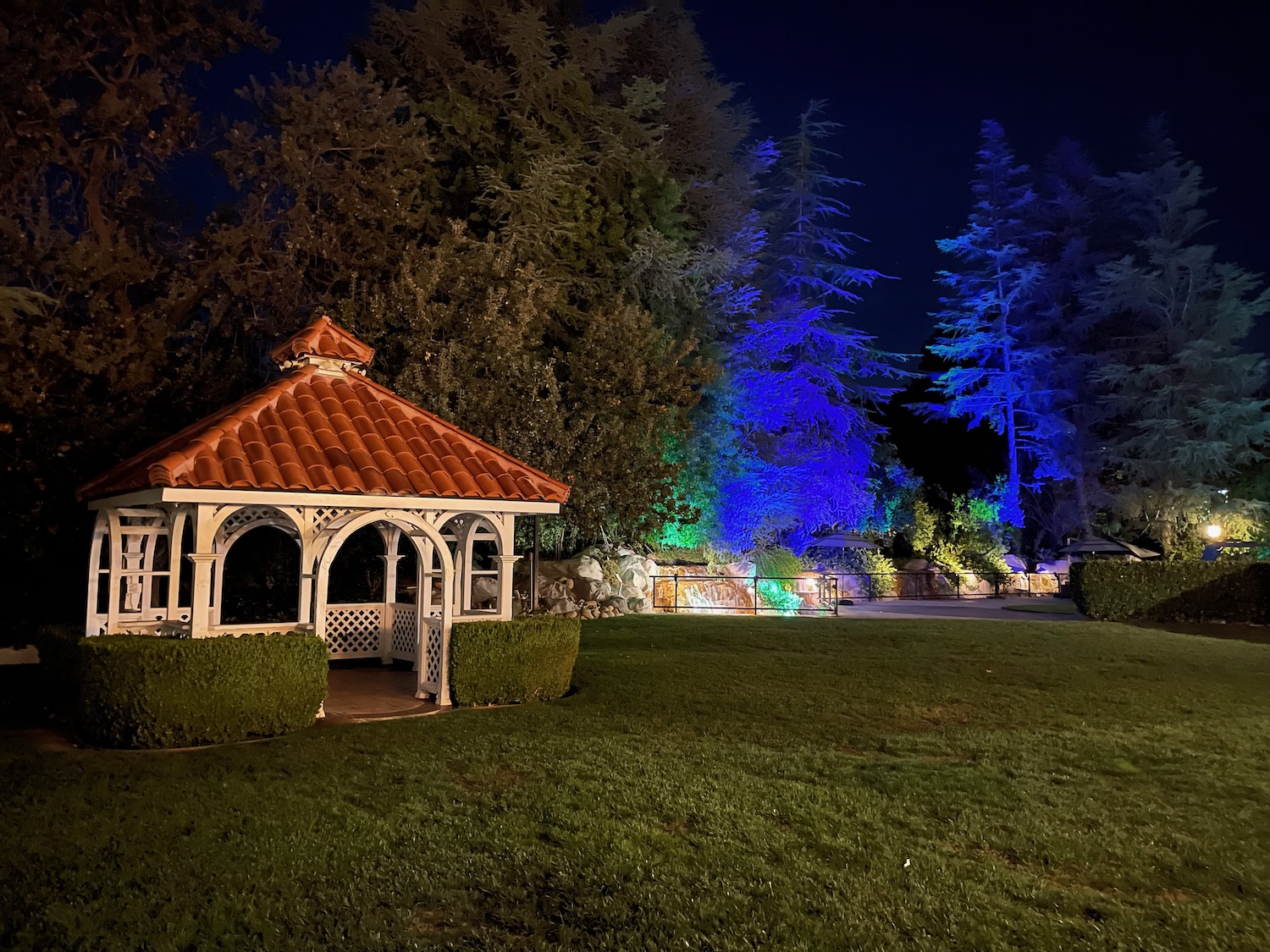 a gazebo in a park at night