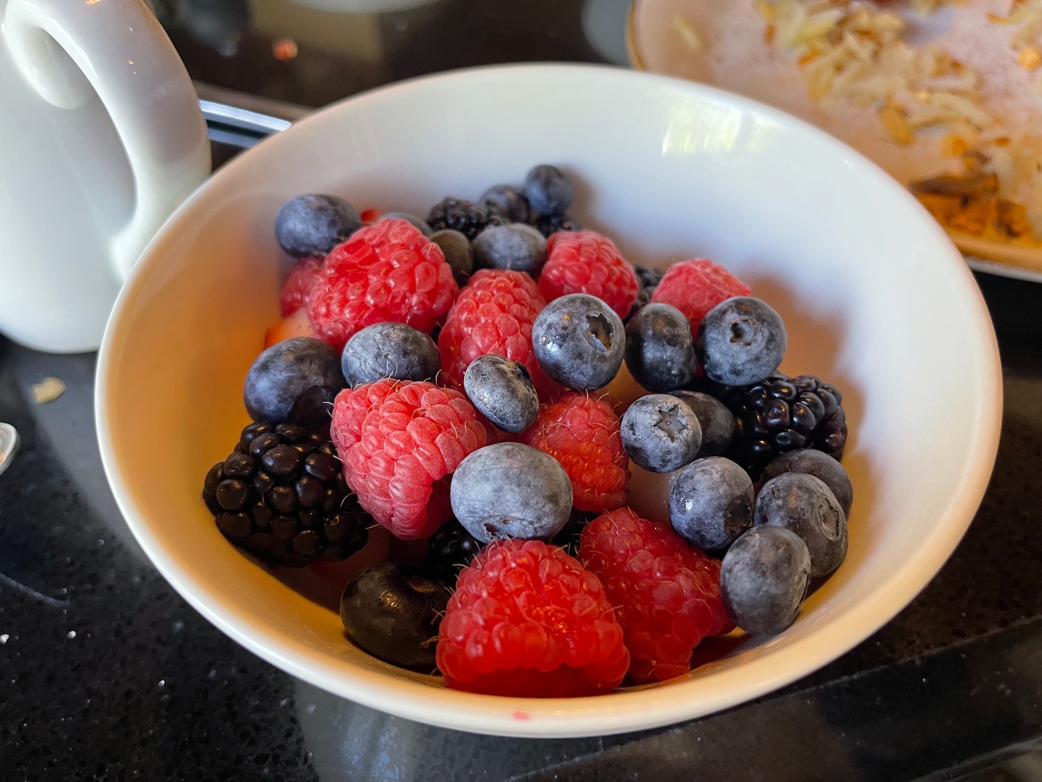a bowl of berries on a table