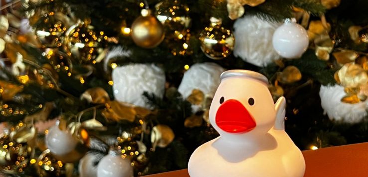 a white rubber duck on a table