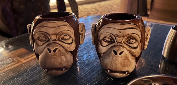two monkey mugs on a table