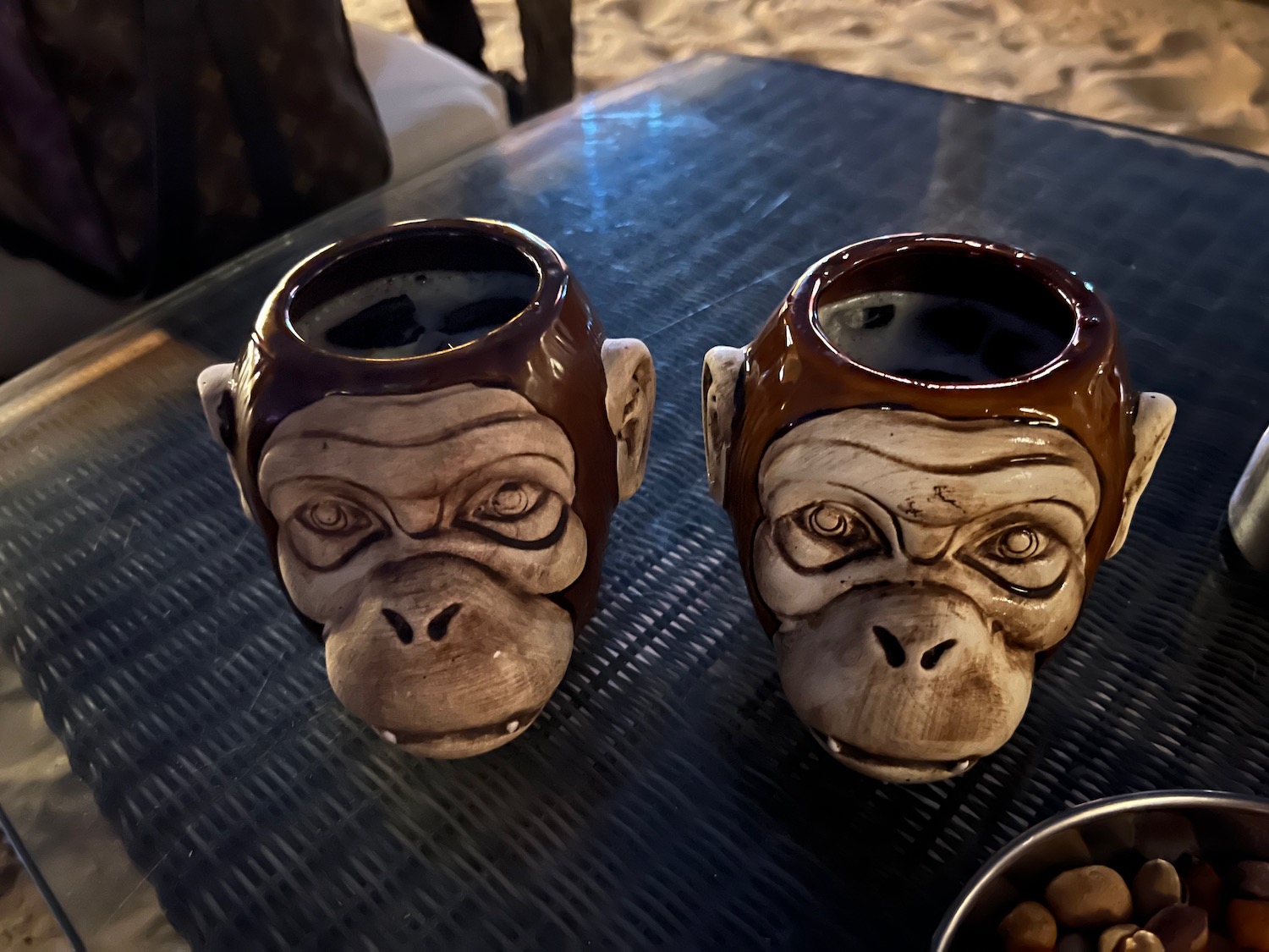 two monkey mugs on a table