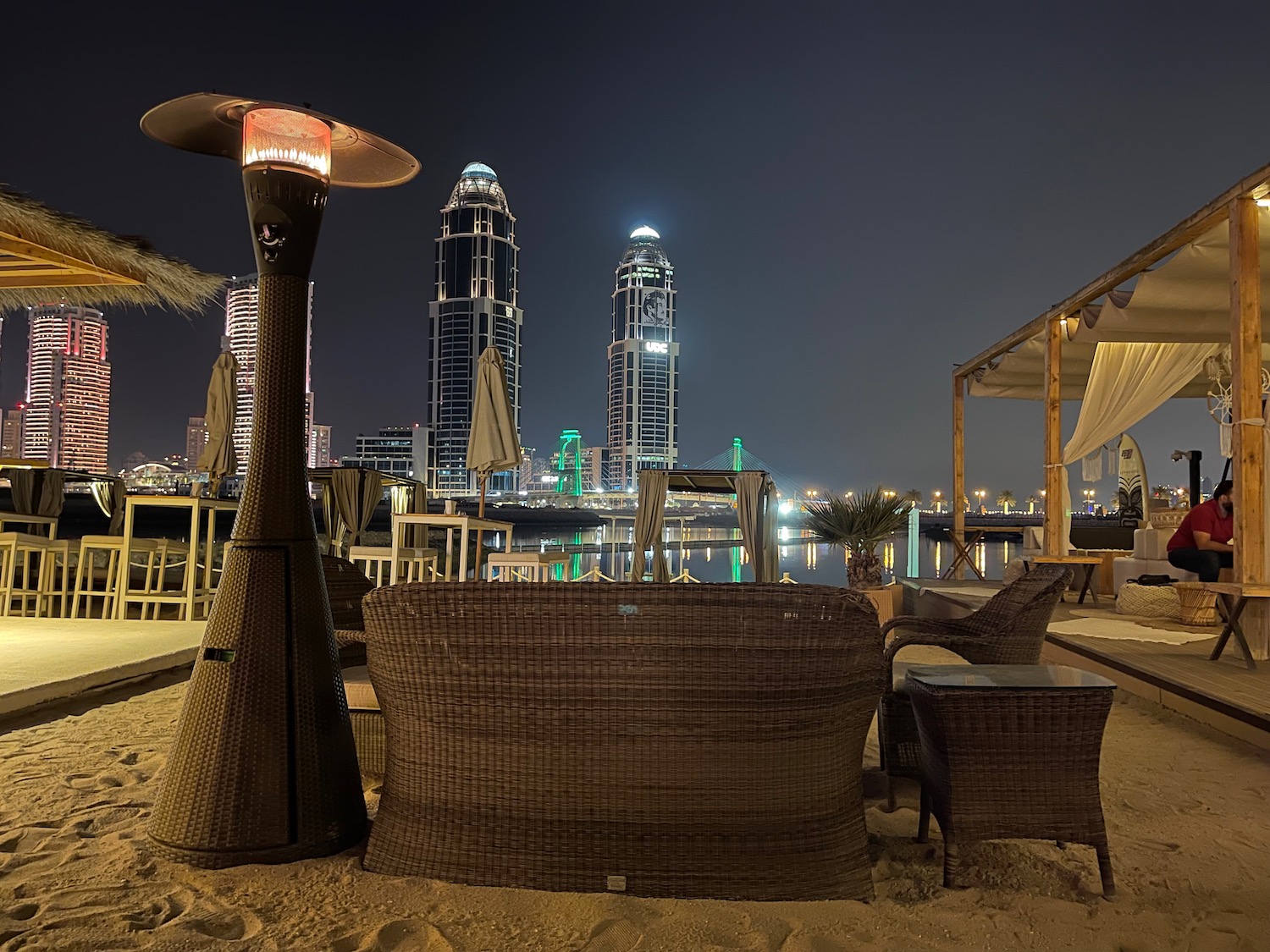 a table and chairs on a beach