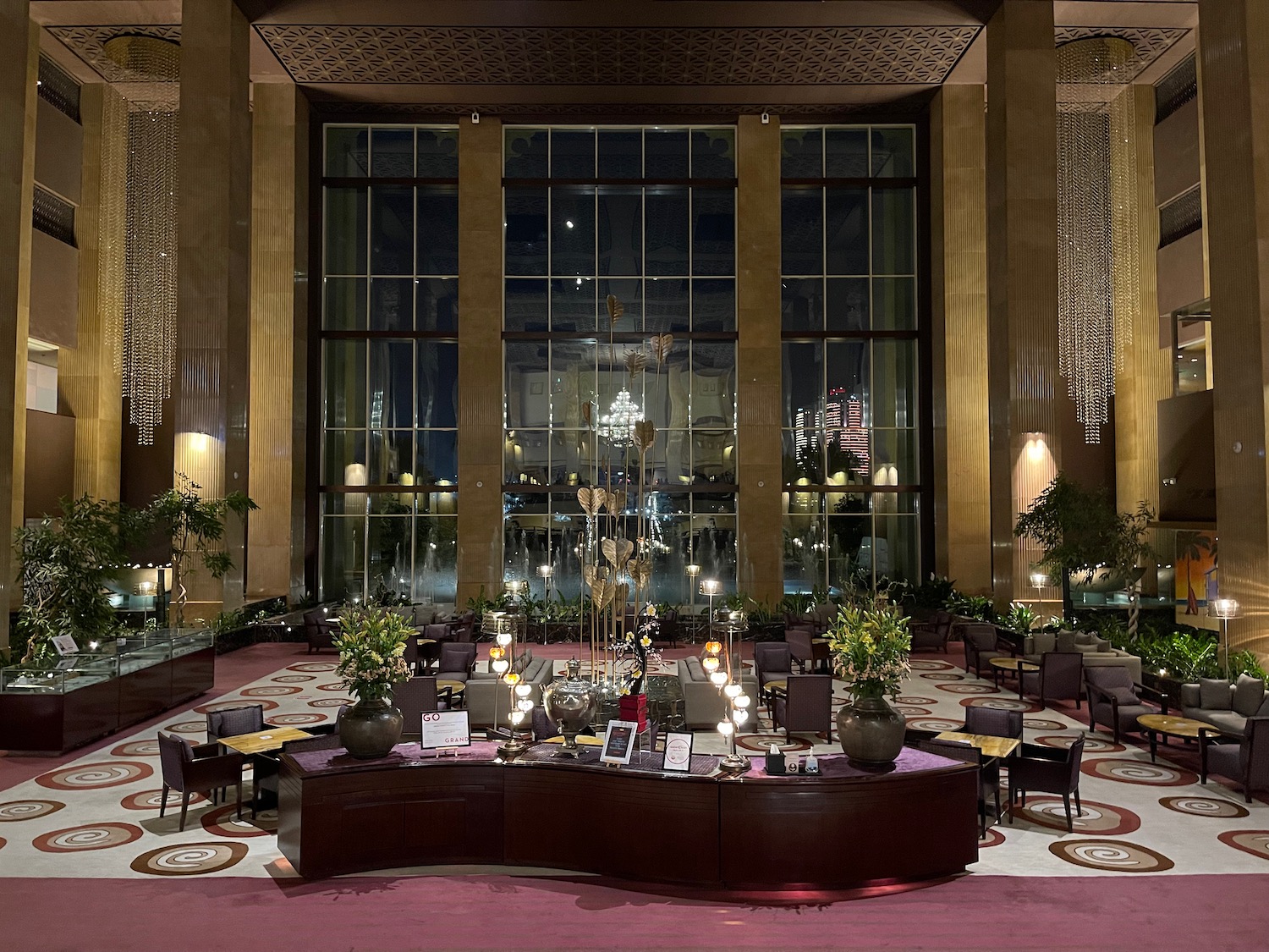 a large room with a chandelier and tables