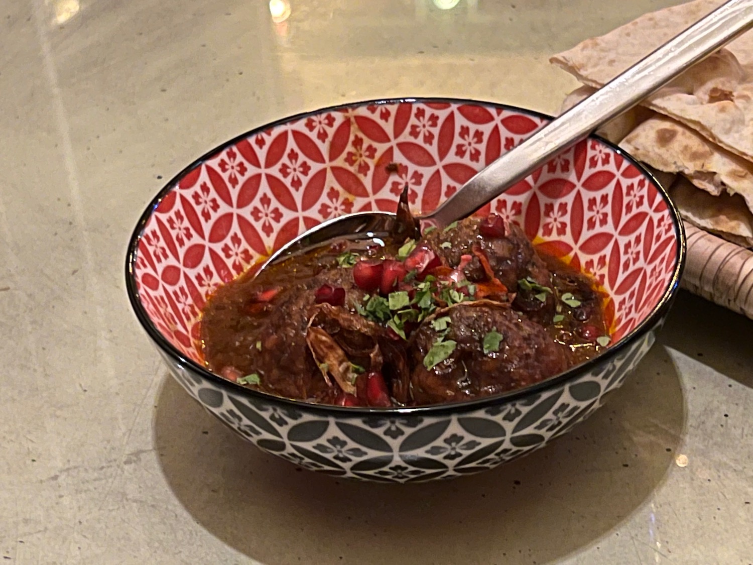 a bowl of food with a spoon