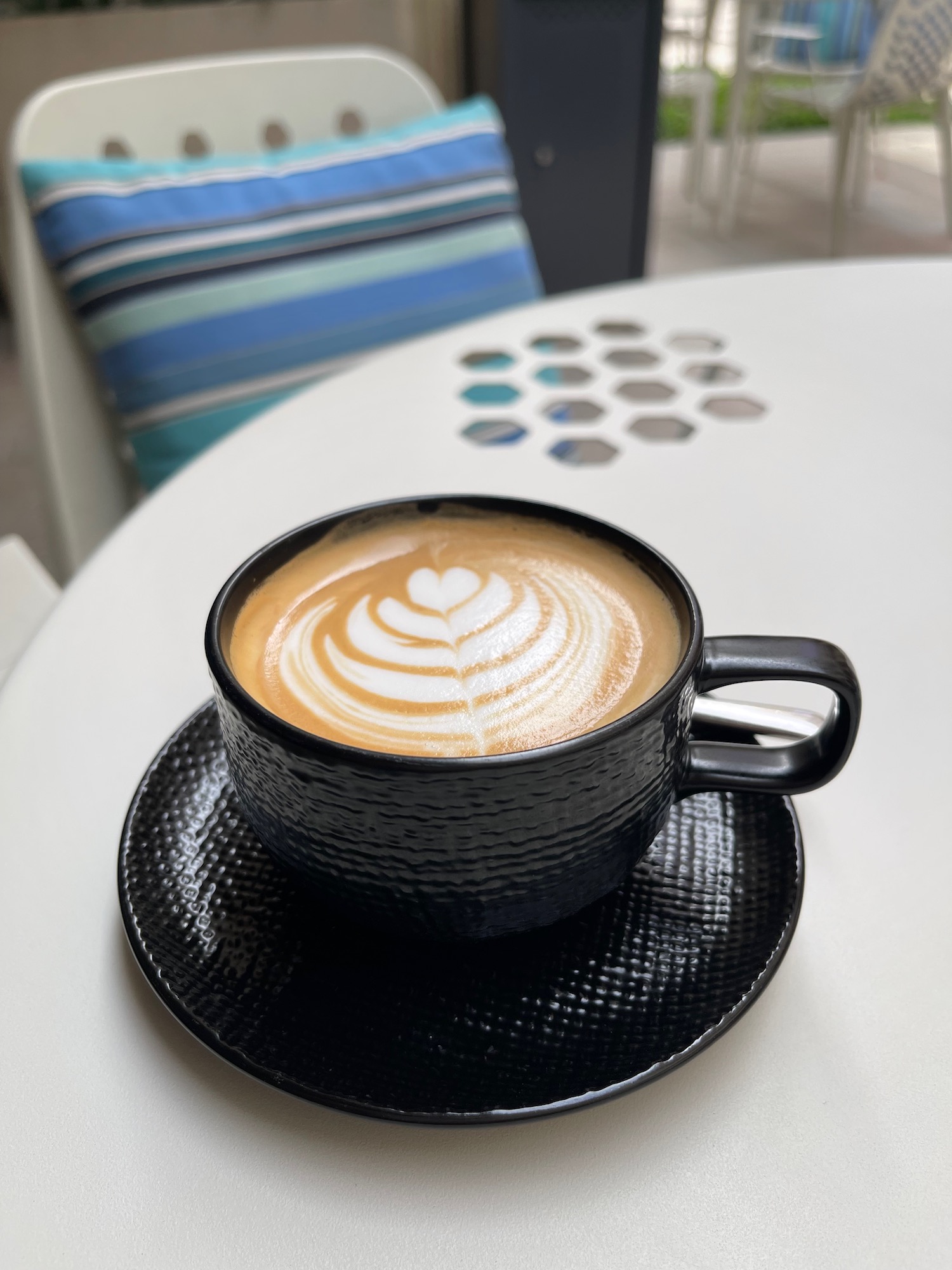 a cup of coffee on a white table