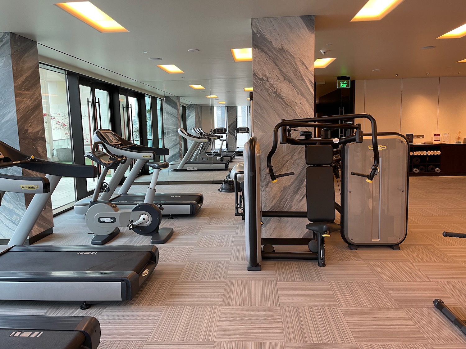 a gym with treadmills and exercise equipment