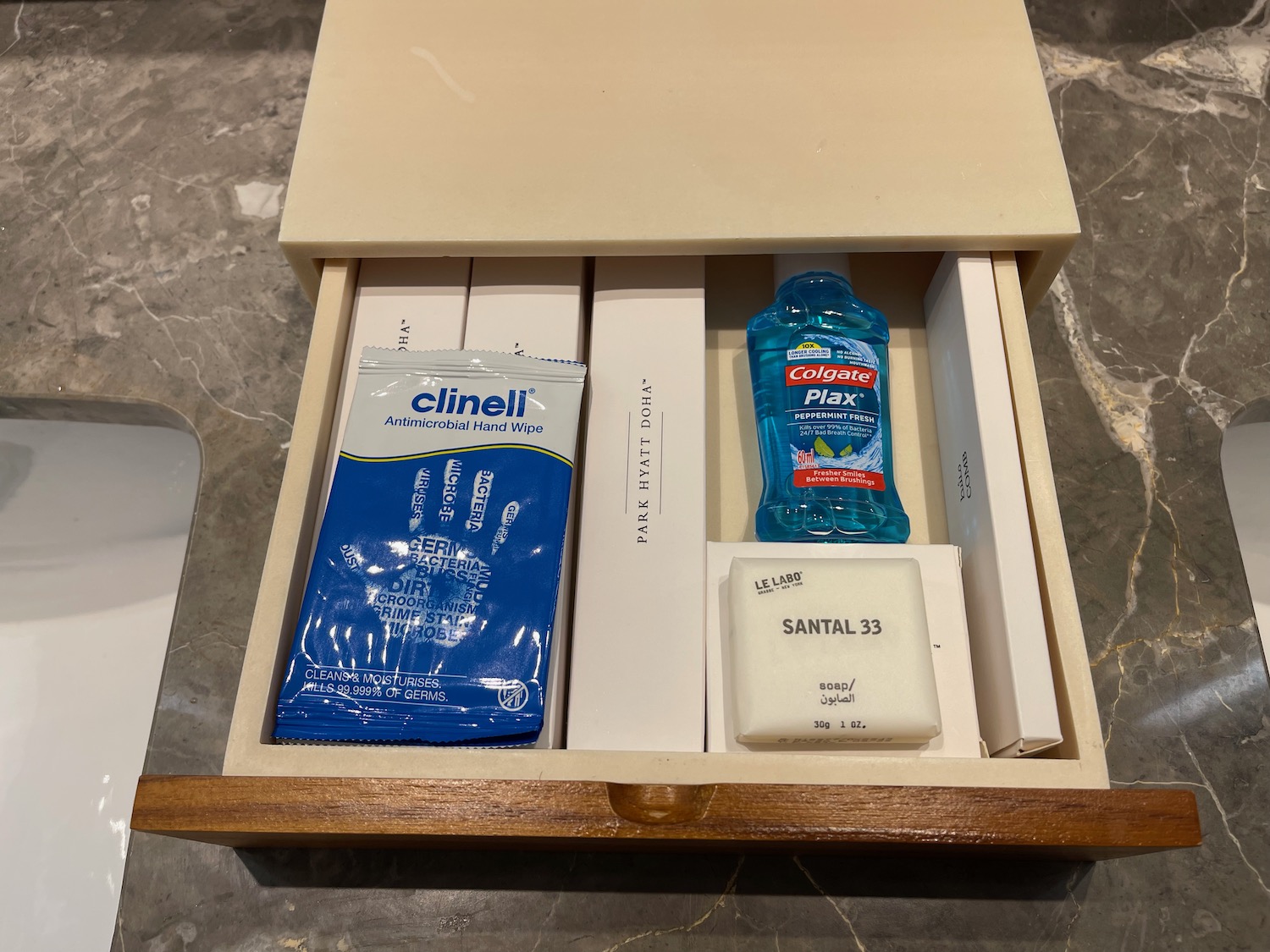 a box with a bottle and a soap in it