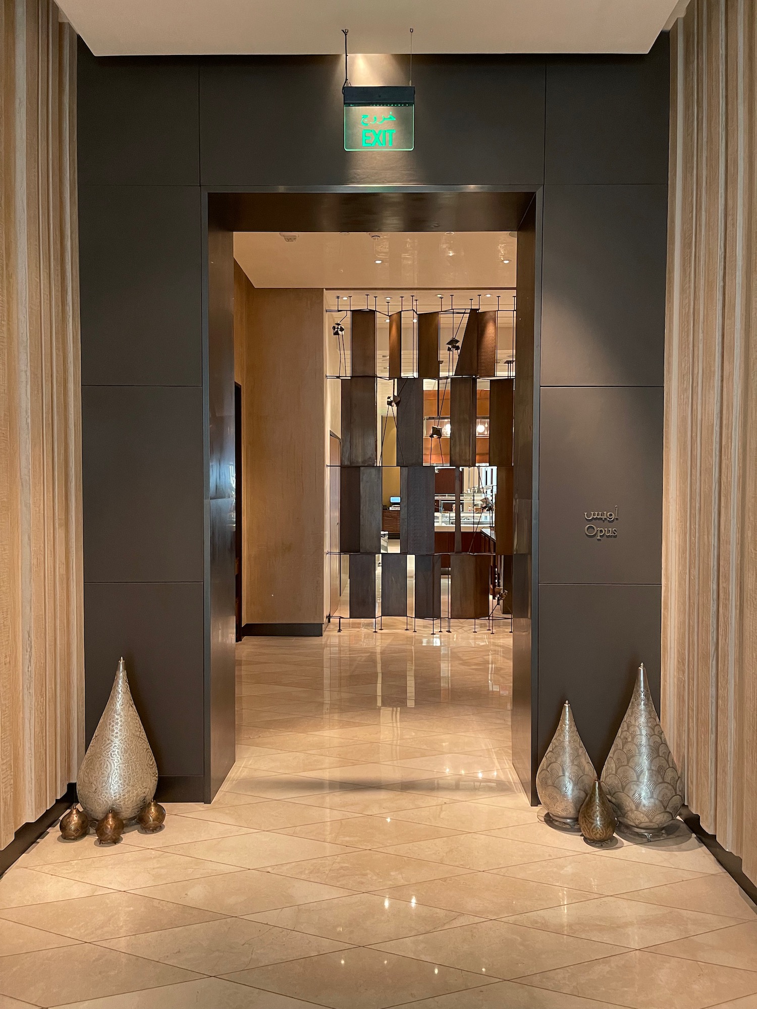 a hallway with a door and a sign