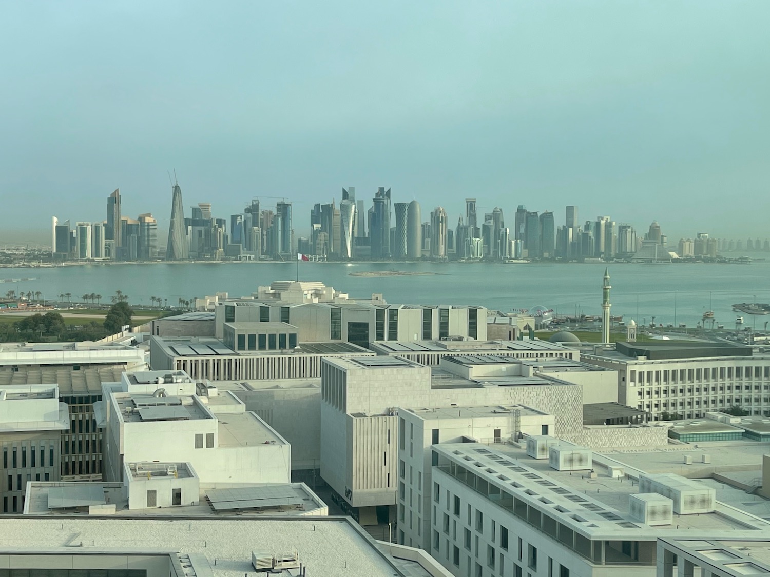 a city skyline with water in the background