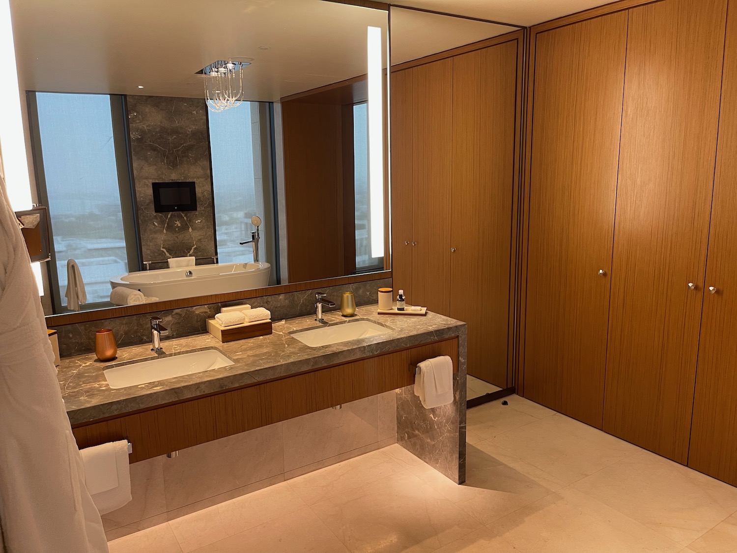 a bathroom with a large mirror and sinks