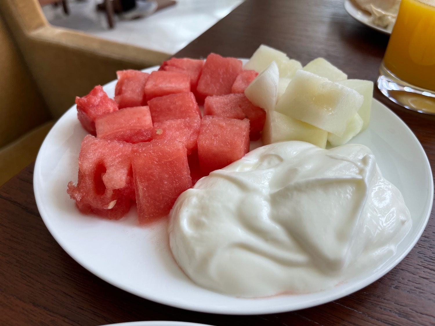 a plate of fruit and yogurt