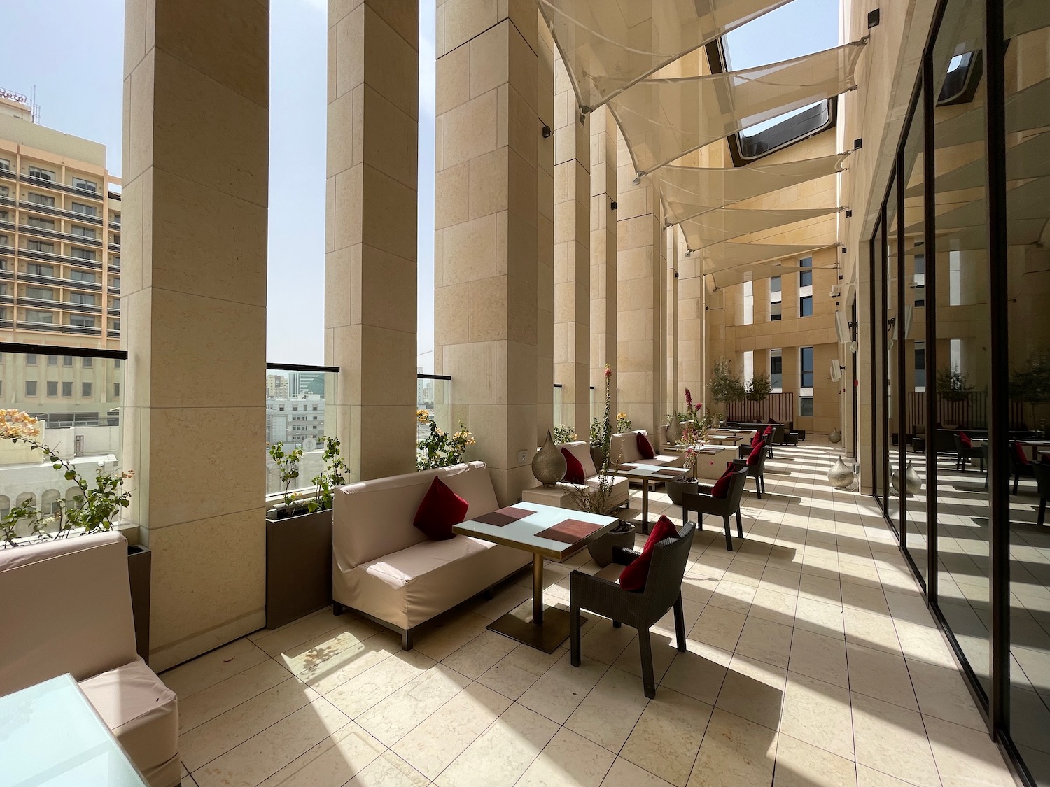 a patio with tables and chairs