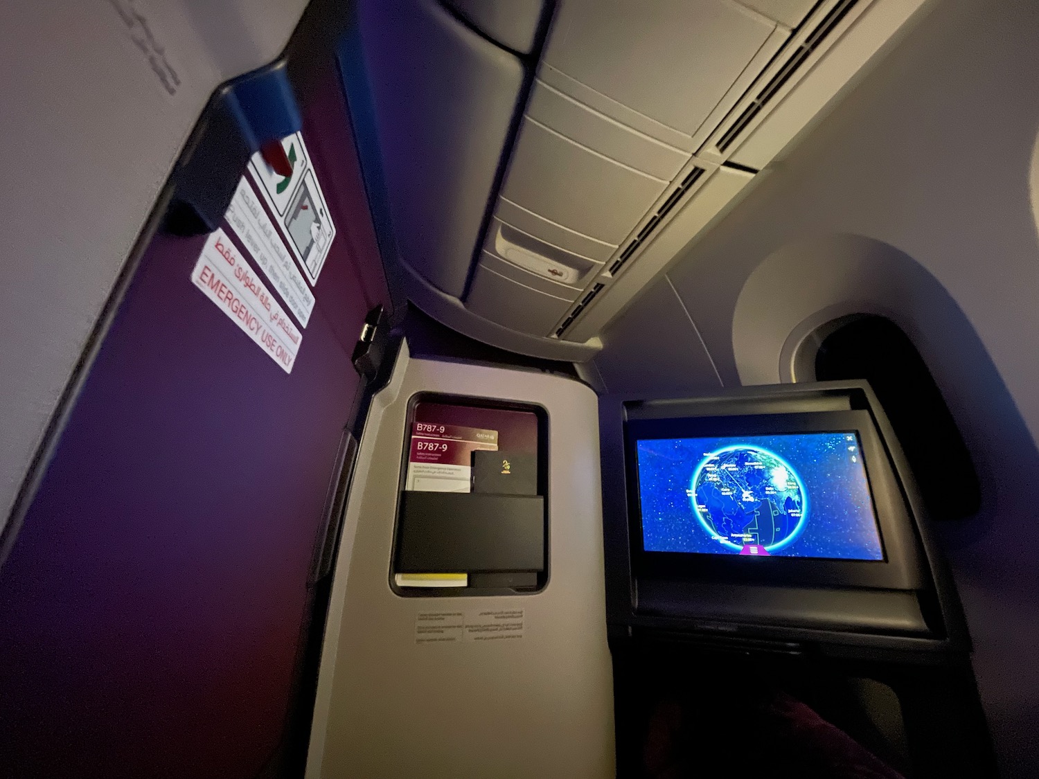 a screen and a computer in an airplane