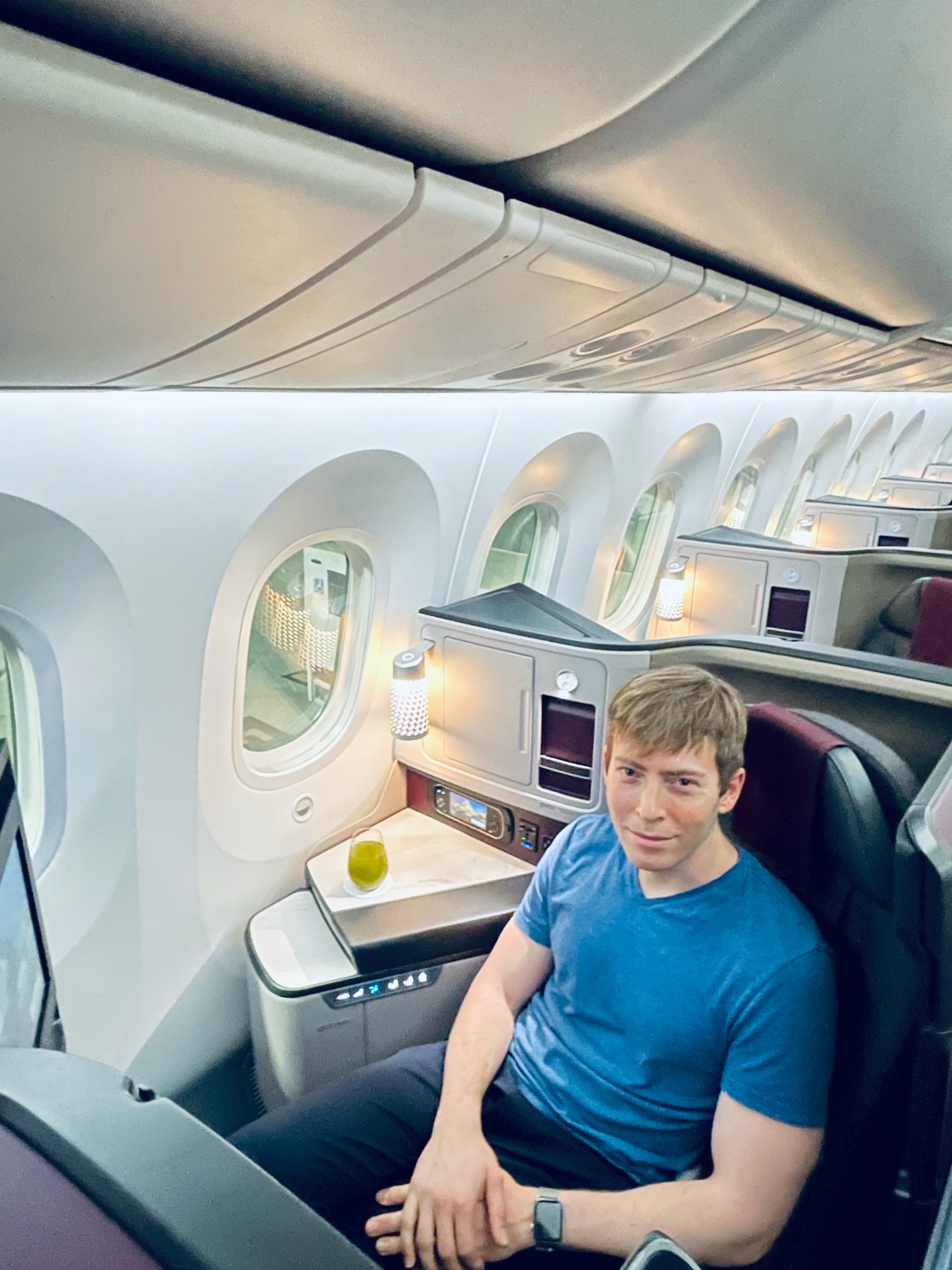 a man sitting in a chair in an airplane