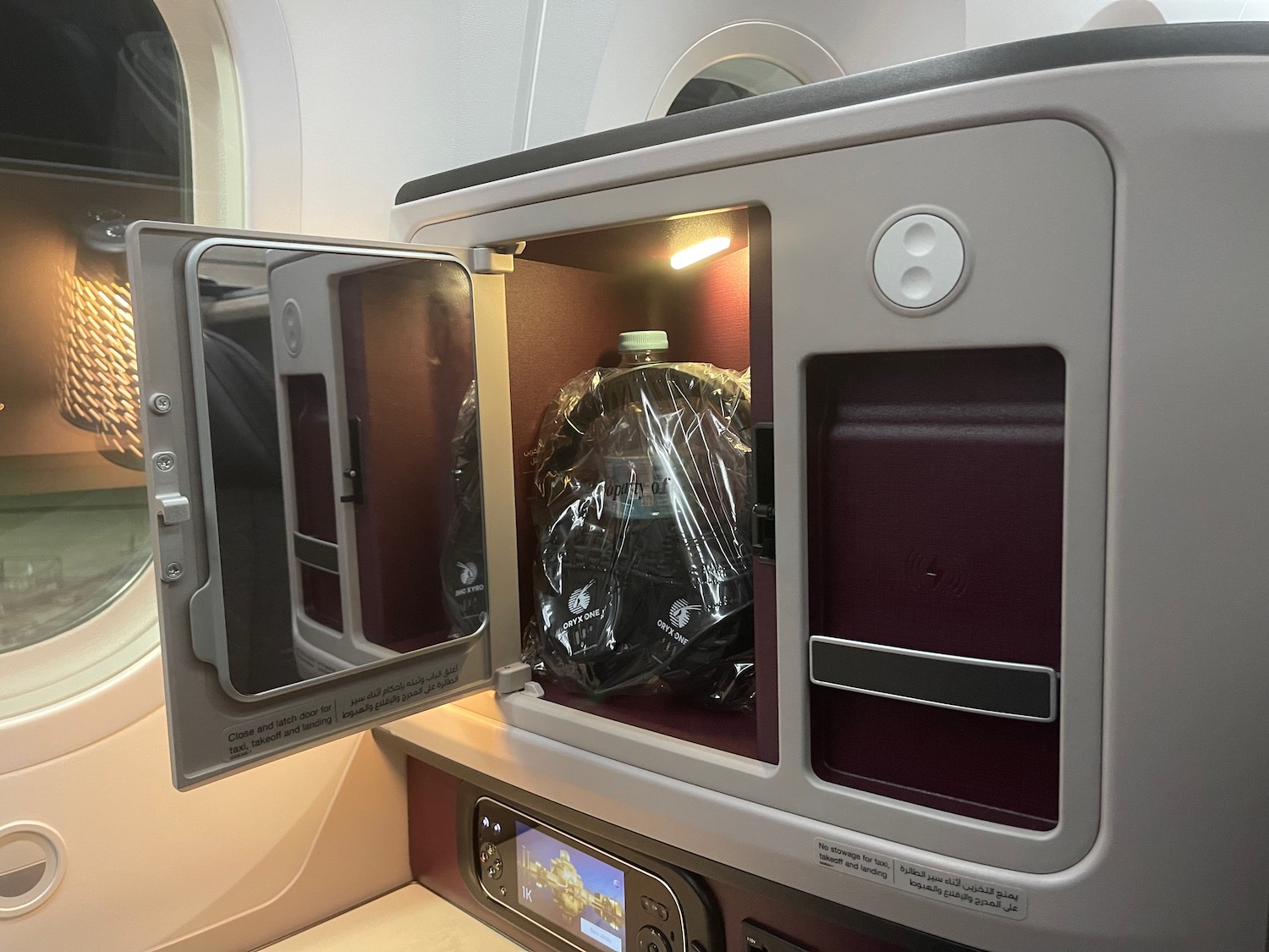 a plastic bag inside a small cabinet