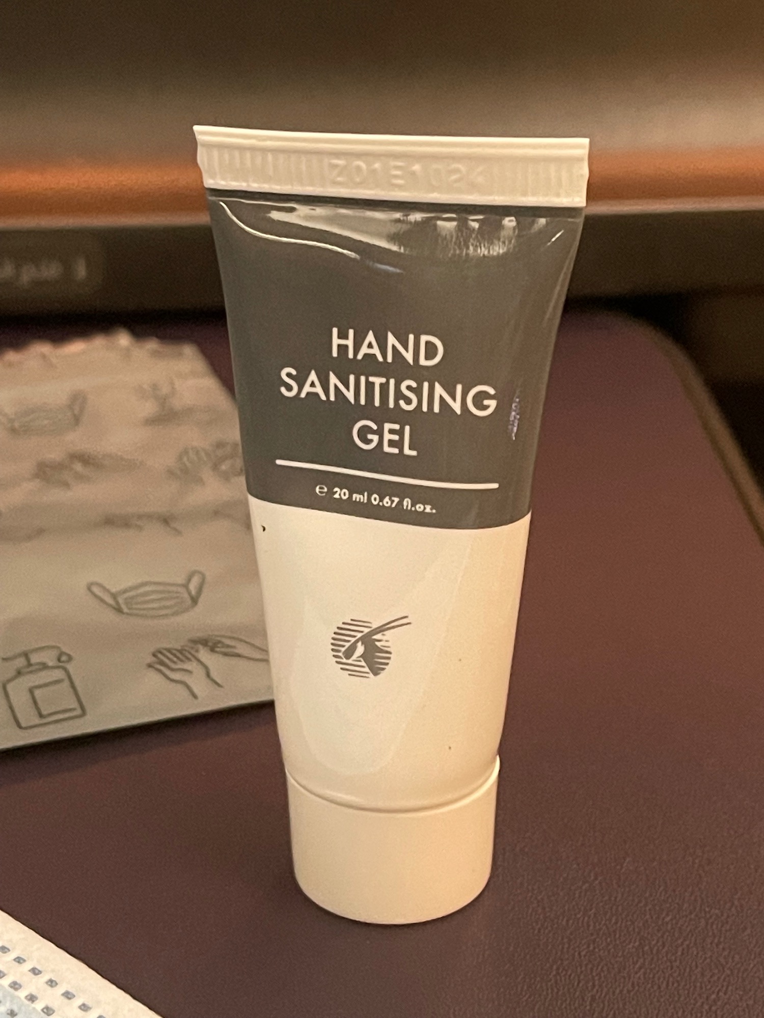 a white and grey tube of hand sanitizer
