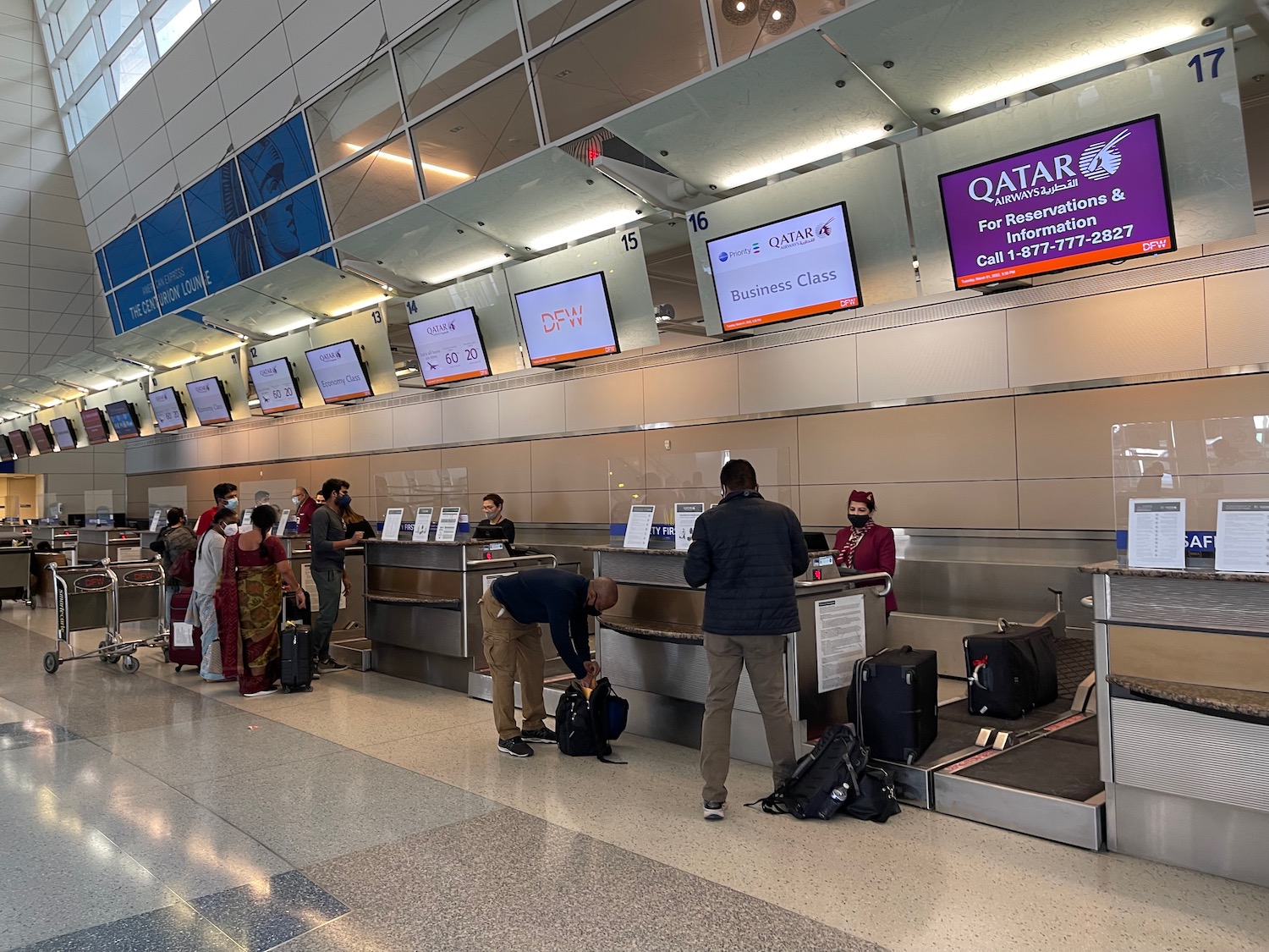 people standing in a line at a counter