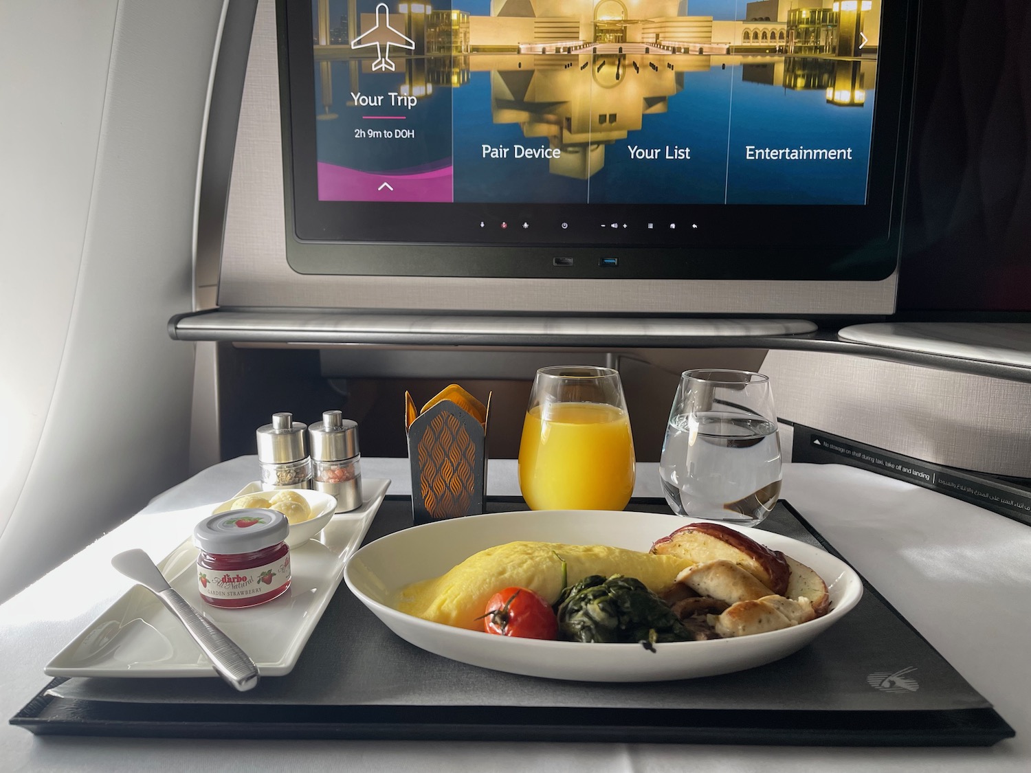 a plate of food on a tray with a television