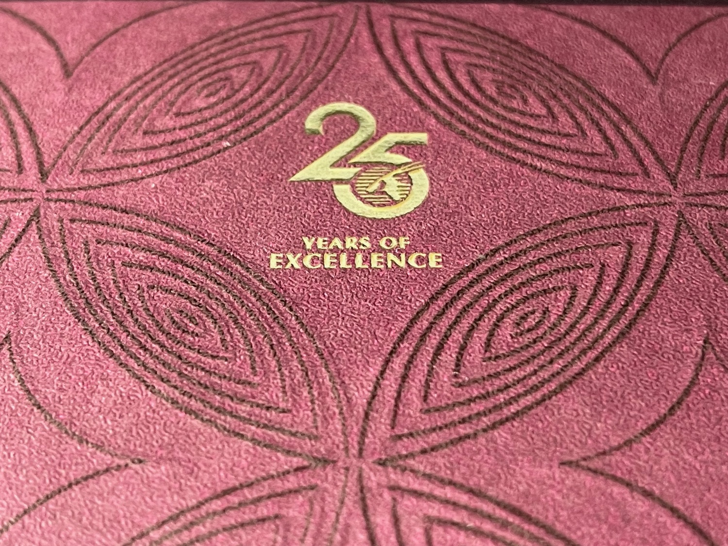 a red book with a gold logo