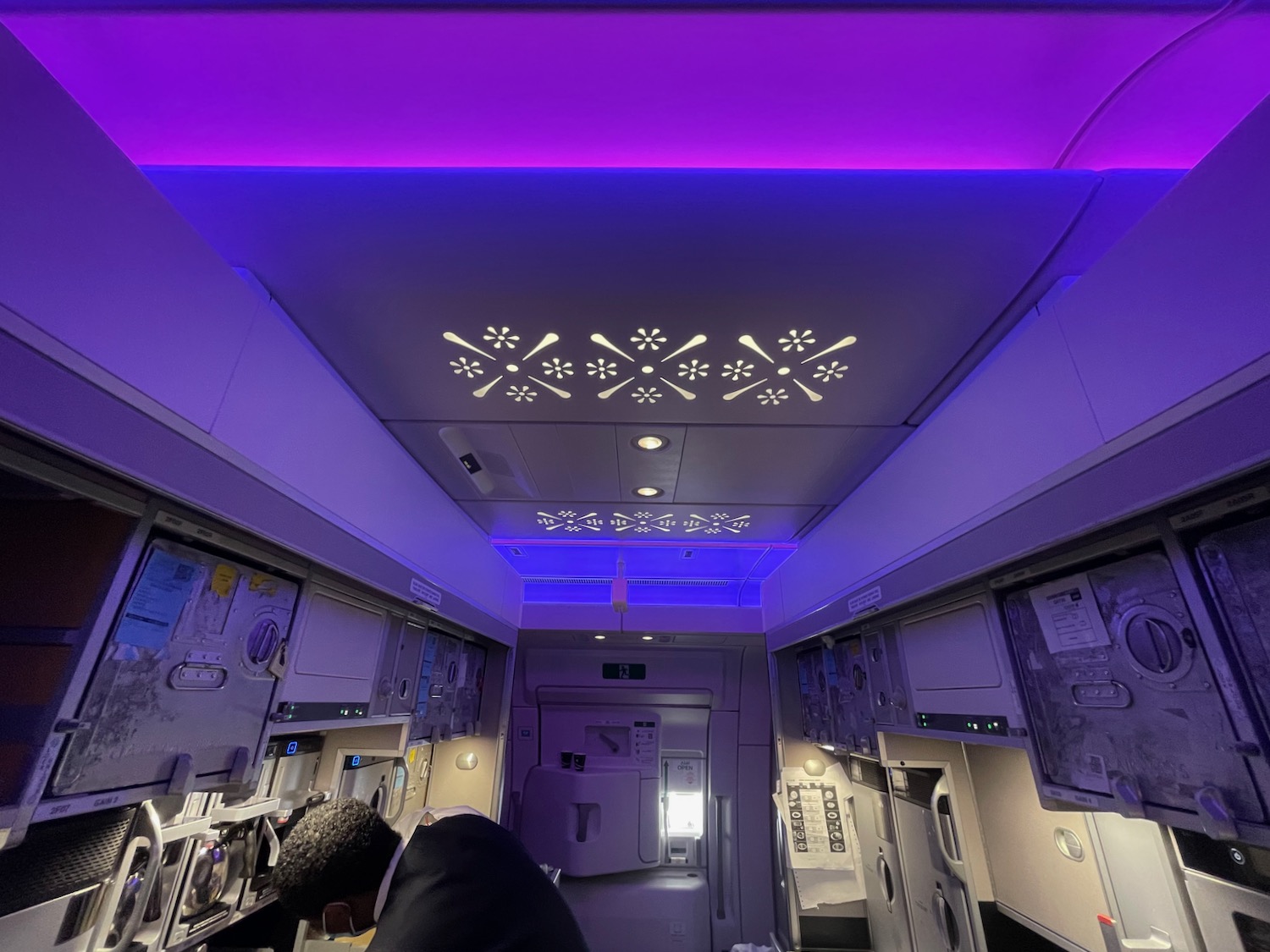 a inside of a plane with purple lighting