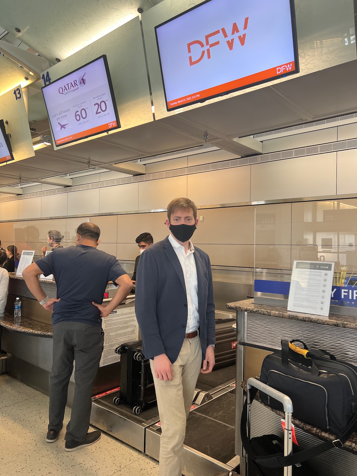 a man wearing a face mask in a airport