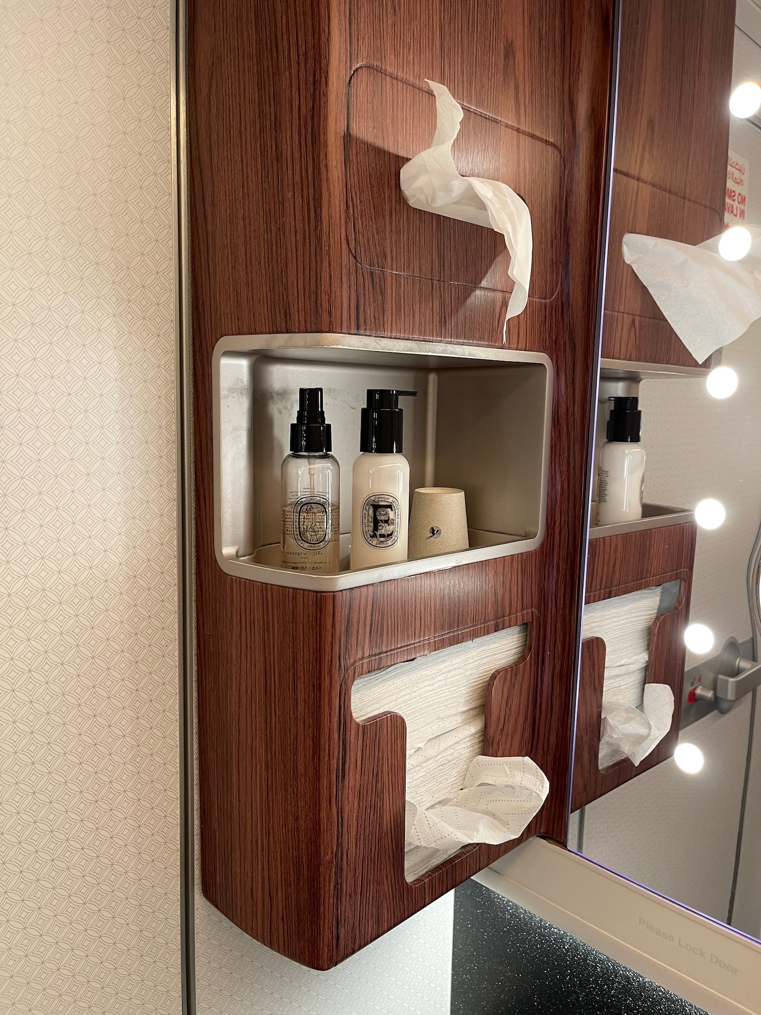 a shelf with toilet paper and toilet paper on it