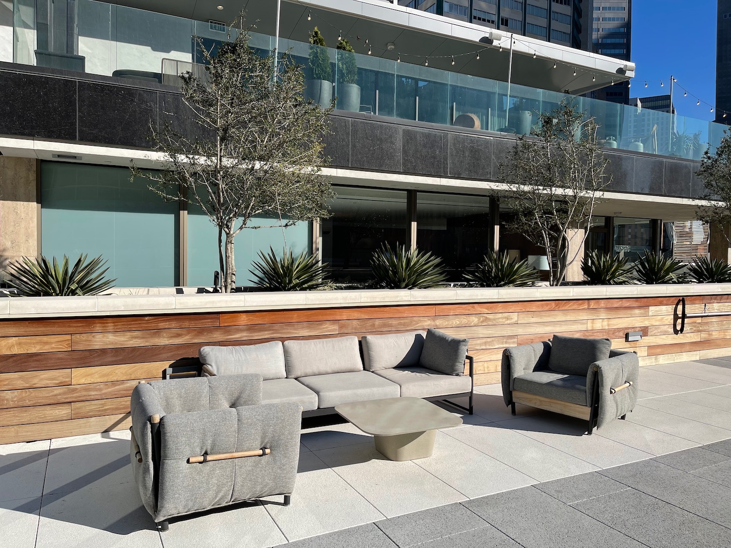 a couches and a table outside of a building
