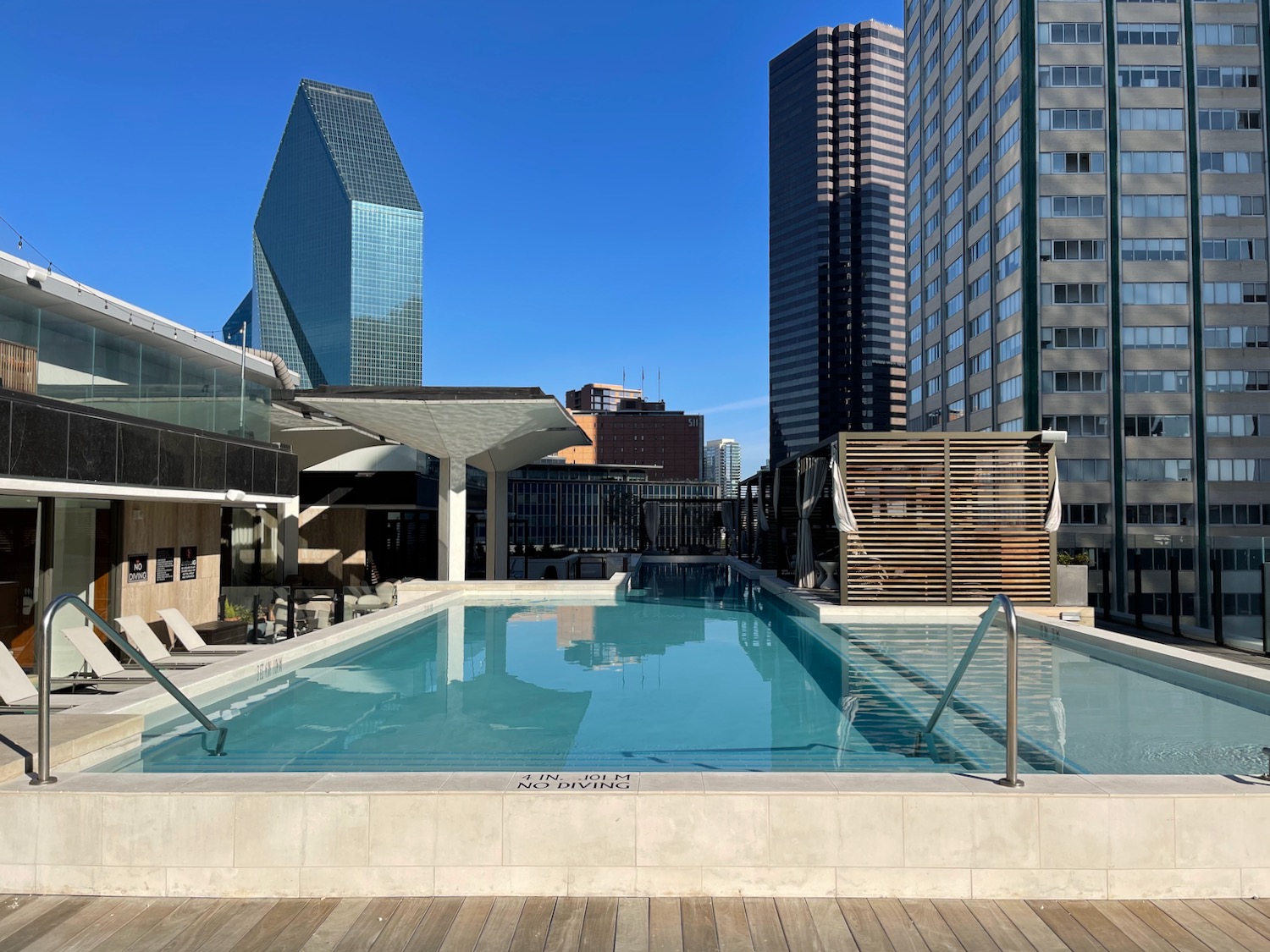 a pool with a building in the background