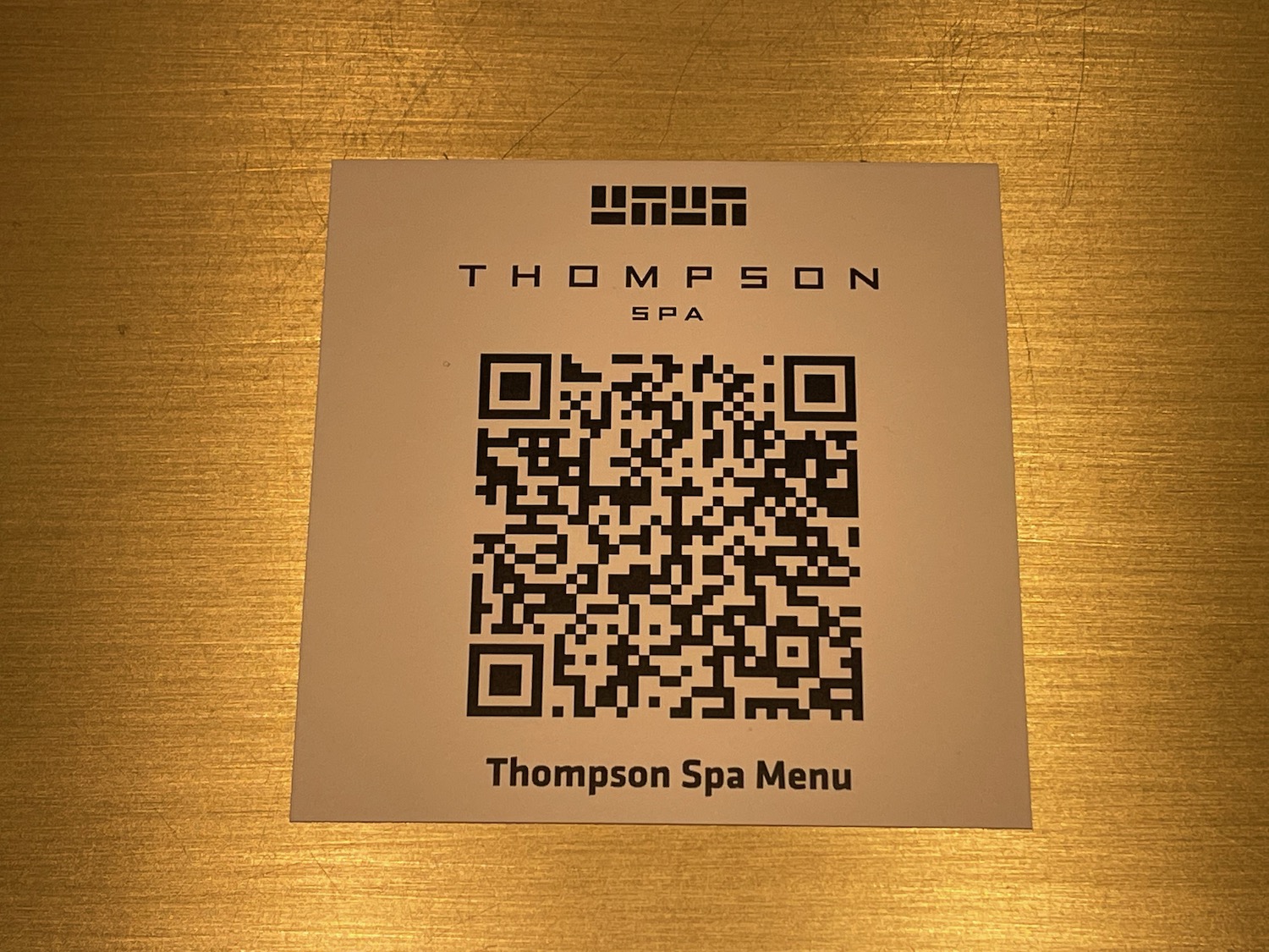 a qr code on a gold surface