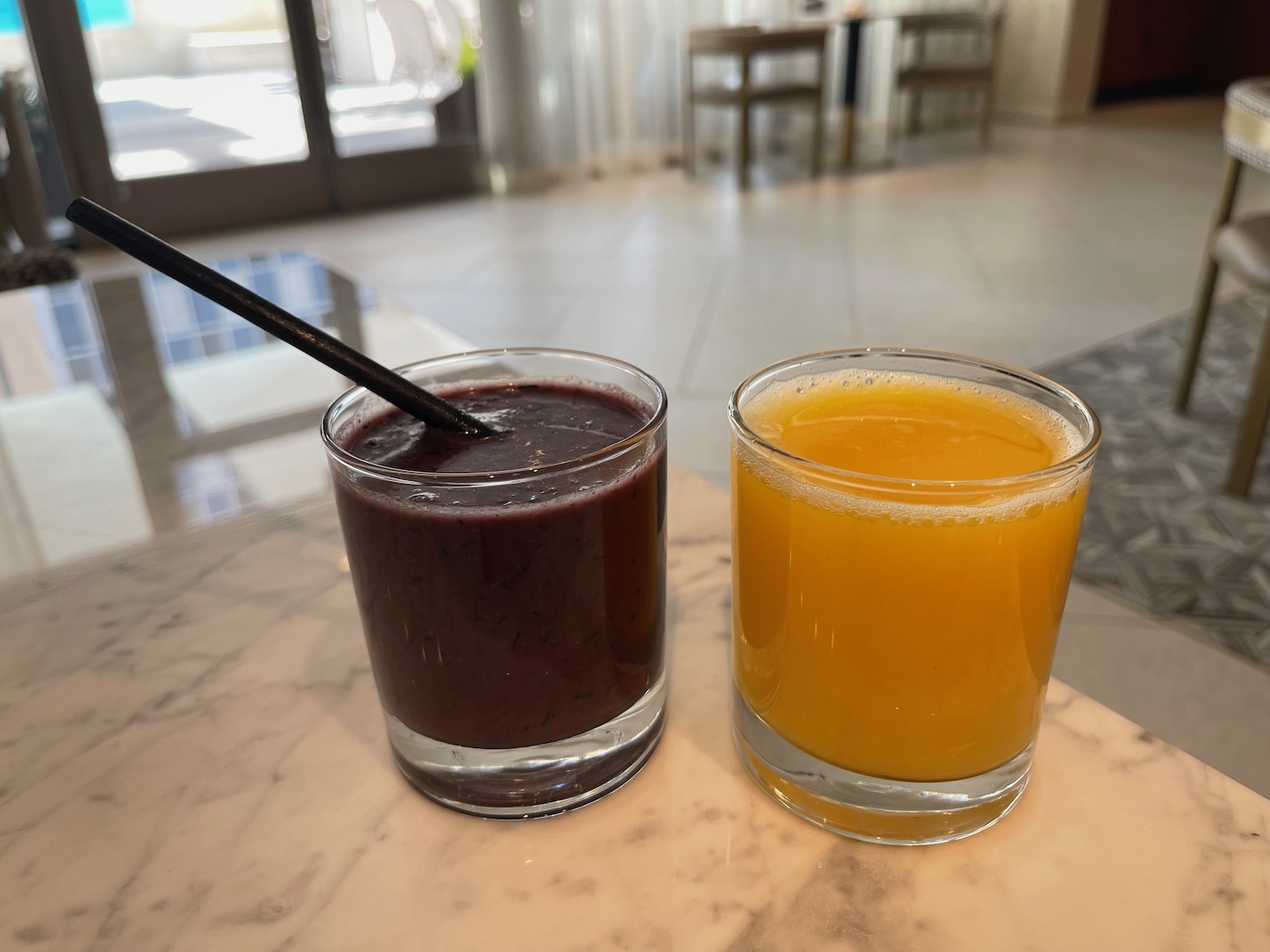two glasses of juice and a drink