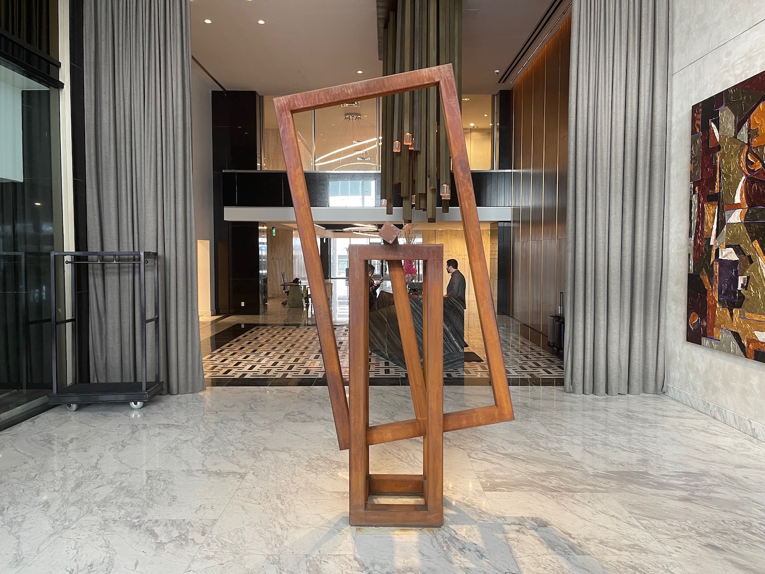 a large wooden sculpture in a lobby