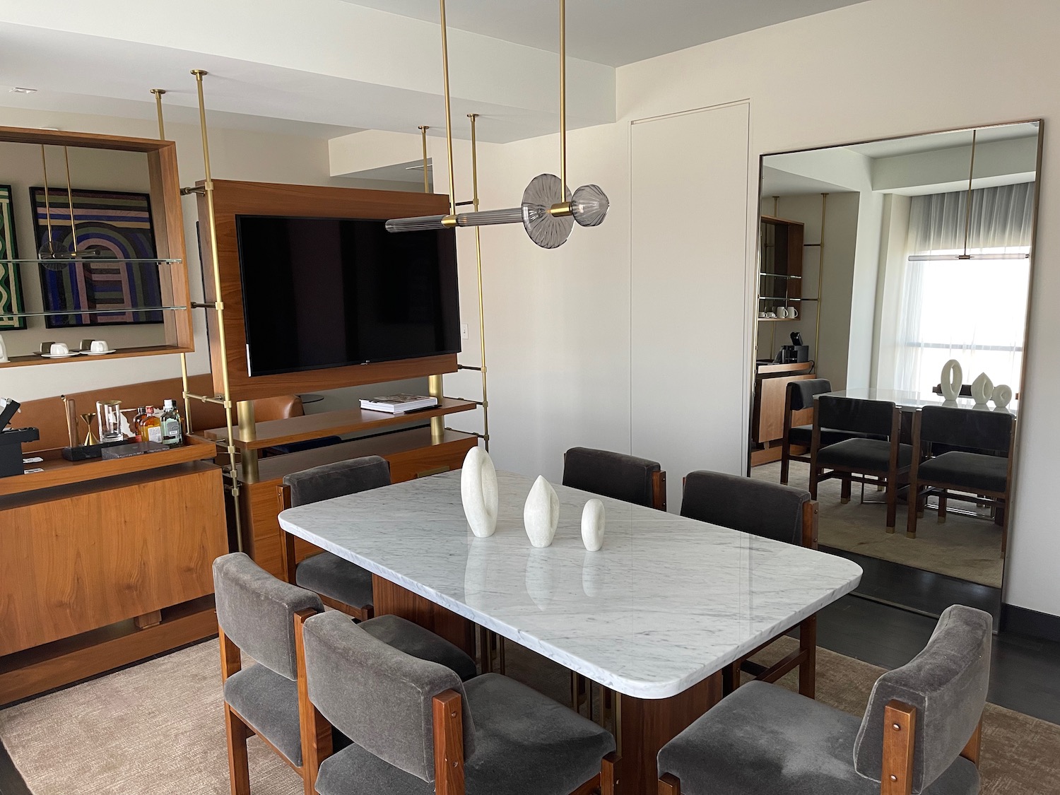 a dining table with chairs in a room