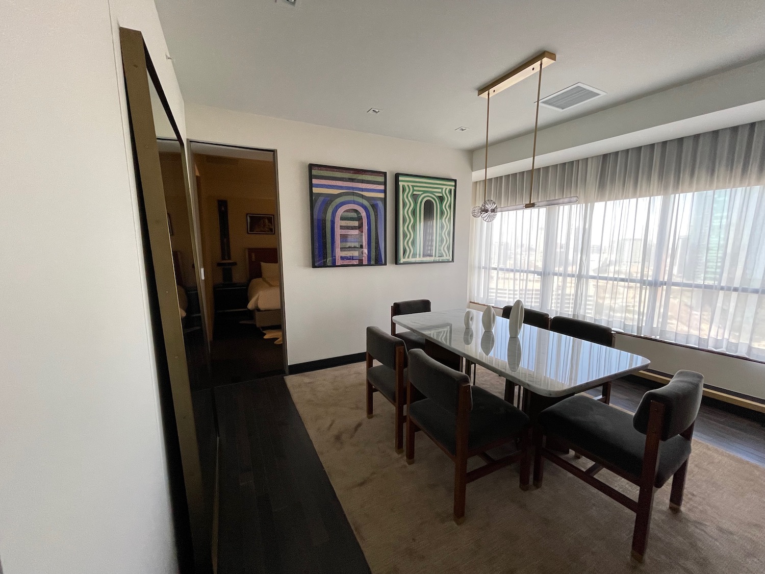 a dining room with a table and chairs