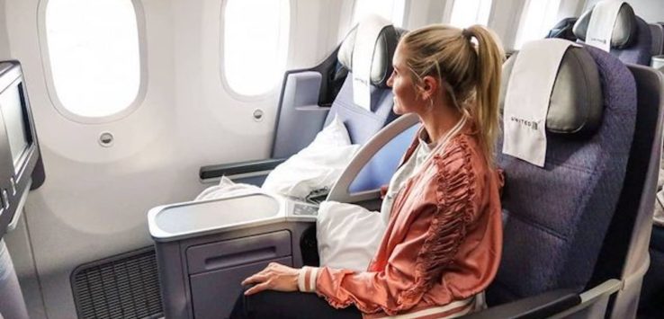 a woman sitting in an airplane